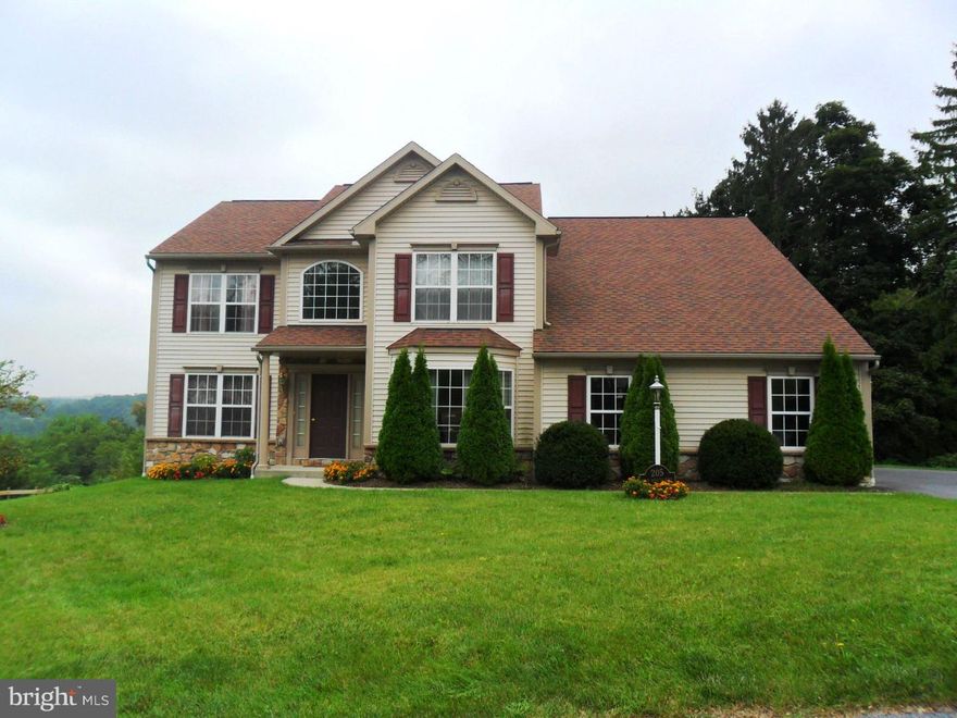 Dramatic 2-story entry. First floor office with den. Hardwood flooring in Living Room, Dining Room and Family Room. Eat-in kitchen overlooking Family room. All new granite counter tops in kitchen with new custom center island Vaulted ceiling in Master Bedroom, first floor office/den, daylight basement, deck. New high efficiency heating system. Freshly painted throughout.