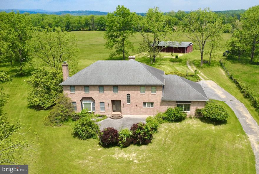 ***ALL OFFERS DUE ON MONDAY JUNE 2ND (6/2/2025) BY 5:00PM!***

SECLUDED 84 ACRE ESTATE WITH CHARMING COLONIAL STYLE HOME AND PRIVATE STREAM!
84.47 +/- acre gentleman’s farm near Fairfield.  Drive down the tree lined lane to a 5 bedroom 4 bath colonial style home situated in a beautiful secluded setting.  This brick house with hardwood floors and fireplaces offers many options as a full time residence or recreational retreat with enough room for family or guests.  Just outside, a peaceful stream and wooded area gives many opportunities to enjoy wildlife.  The land shares roughly equal tillable and wooded acres.  Soils are silt loam types and are currently growing hay.  The wooded areas  and stream offer great opportunity for hunting, relaxation, and estate living.  Another amenity this property offers is a five stall horse barn. Combined with acres of riding possibilities, this property holds much potential for equestrian activities as well.  A run-in shed for various animals and hay shed round out the structures on the property. For the history buff, the farm encompasses the Carrolsburs Cemetary, with history dating to the Revolutionary War/War of 1812.  Overall, with plenty of room for farming, hunting, riding, or just relaxation, this versatile piece offers incredible potential.  Don’t miss this rare opportunity to own your slice of country paradise!