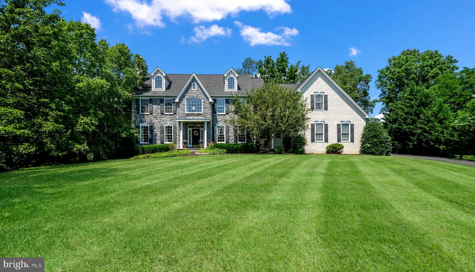 Welcome to 1142 Darczuk Drive featuring a ton of upgrades throughout this Magnificent Home
Located in the sought-after Pondview community in Garnet Valley, this gracious, upgraded, and beautifully appointed 5 bedrooms, 5 bath home sits at the top of a tree-lined driveway on nearly 1 acre. Beautiful mature landscaping, a large backyard, and a raised terrace in imported Italian Travertine.
The Breathtaking front-to-back entry with a turned hardwood stairway is flanked by the formal living room with a working fireplace and a spacious dining room. Brazilian Teak hardwood floors, stone inlay in the foyer, wainscotting, and crown molding upgrades throughout the house. At the top of the main staircase is a reading nook and a view of mature trees. The large first-floor Billiard/Study is situated to the rear of the living room with a great backyard view. French doors and transom windows fill the house with light.
The family area features an open floor plan with an expansive, upgraded Chef’s Kitchen featuring beautiful cabinets and granite counters opening to the spacious morning room with patio access. Step down to an inviting family room with a gas fireplace, back stairway, and Butler’s Pantry. The Mudroom has garage access, a powder room, a desk, and spacious closet space.
The primary bedroom includes a sitting room, a large bedroom area, 2 walk-in professionally organized closets, an expanded bathroom with a cathedral ceiling, a large soaking tub, 5-head tile shower, a private water closet, and 2 vanities. There are 4 large additional bedrooms. Don’t miss the roomy 2nd-floor laundry room with a utility sink.
The finished walk-out basement is the perfect place to entertain with a fun restored bar from a “locally famous” tap room. Pre-plumbed full bathroom ready to be completed. A large section of the basement is unfinished with built-in shelving. New roof 8 years ago (2014). a new water heater in 2021, and new Trane heaters in 2017.
The 3-car garage provides additional storage, and the expanded driveway allows for extra parking.
Spacious closets throughout the home.
The Picturesque yard is a wonderful oasis with beautiful plantings. This elegant home is in the award-winning Garnet Valley School District.