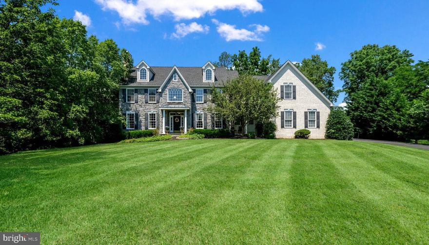 Welcome to 1142 Darczuk Drive featuring a ton of upgrades throughout this Magnificent Home
Located in the sought-after Pondview community in Garnet Valley, this gracious, upgraded, and beautifully appointed 5 bedrooms, 5 bath home sits at the top of a tree-lined driveway on nearly 1 acre. Beautiful mature landscaping, a large backyard, and a raised terrace in imported Italian Travertine. 
The Breathtaking front-to-back entry with a turned hardwood stairway is flanked by the formal living room with a working fireplace and a spacious dining room. Brazilian Teak hardwood floors, stone inlay in the foyer, wainscotting, and crown molding upgrades throughout the house. At the top of the main staircase is a reading nook and a view of mature trees. The large first-floor Billiard/Study is situated to the rear of the living room with a great backyard view. French doors and transom windows fill the house with light.
The family area features an open floor plan with an expansive, upgraded Chef’s Kitchen featuring beautiful cabinets and granite counters opening to the spacious morning room with patio access. Step down to an inviting family room with a gas fireplace, back stairway, and Butler’s Pantry. The Mudroom has garage access, a powder room, a desk, and spacious closet space. 
The primary bedroom includes a sitting room, a large bedroom area, 2 walk-in professionally organized closets, an expanded bathroom with a cathedral ceiling, a large soaking tub, 5-head tile shower, a private water closet, and 2 vanities. There are 4 large additional bedrooms. Don’t miss the roomy 2nd-floor laundry room with a utility sink. 
The finished walk-out basement is the perfect place to entertain with a fun restored bar from a “locally famous” tap room. Pre-plumbed full bathroom ready to be completed. A large section of the basement is unfinished with built-in shelving. New roof 8 years ago (2014). a new water heater in 2021, and new Trane heaters in 2017.  
The 3-car garage provides additional storage, and the expanded driveway allows for extra parking. 
Spacious closets throughout the home. 
The Picturesque yard is a wonderful oasis with beautiful plantings. This elegant home is in the award-winning Garnet Valley School District.