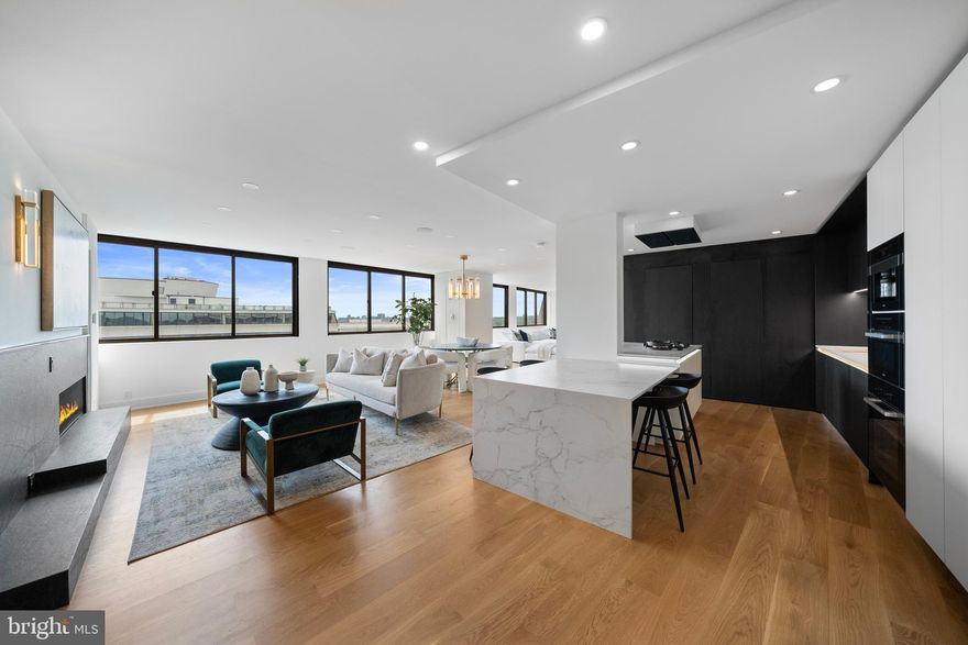 Sited atop Watergate South, Penthouse #1502/3 is a rare double-unit residence offering 3,240 square feet of exquisitely reimagined living space. Overlooking the Kennedy Center, Potomac River, and Northern Virginia, this premier home blends architectural sophistication with sweeping panoramas and incredible southern views!

Thoughtfully redesigned by CoreBuild+, the residence showcases top-tier finishes, white oak flooring, a sculptural staircase, and numerous windows that flood the space with light. The open-concept layout features a sleek kitchen with Bauformat cabinetry, Dekton surfaces, and a full suite of integrated Miele appliances, including a built-in espresso system and Pitt Cooking burners.

The primary suite is a tranquil escape with a spa-style bath, freestanding tub, and large, custom dressing room. Two additional bedrooms are included in this offering —one a second primary with luxe ensuite bath and walk-in-closet. Dual staircases lead to private lofts and terraces: one with a built-in outdoor kitchen and dynamite views, the other a serene retreat with panoramic skyline views.

Additional highlights include a state-of-the-art sound system, two parking spaces, in-unit laundry, and extra storage. Residents enjoy 24/7 concierge service, a saltwater pool, fitness center, and more. The immediate location offers quick access to the Kennedy Center across the street, The Reach, The National Mall, and the Georgetown Waterfront.