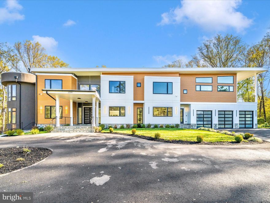 **HUGE PRICE REDUCTION** Immerse yourself in luxury living within this newly built, architecturally stunning 12,000+ square-foot estate set on 2.2 private acres in Northern Virginia. The grand 24-foot foyer makes a dramatic first impression, opening to an expansive modern floor plan designed for both sophistication and comfort.
This custom residence showcases five generous bedroom suites, a chef-inspired gourmet kitchen with professional-grade appliances and a separate catering/spice kitchen, plus an impressive two-story office or conservatory that commands attention. Premium design elements include marble and hardwood flooring, sleek ribbon fireplaces, and exquisite crystal lighting throughout.

Step outside to your personal retreat featuring a heated saltwater pool, elevated terraces, sprawling patios, and manicured landscaping ideal for entertaining or unwinding in total privacy.
Additional amenities include a state-of-the-art home theater, fitness studio, elevator, three-car garage, wet bar, morning kitchen, and advanced smart-home automation. Convenient direct access to the catering kitchen makes hosting effortless.

Perfectly situated near premier shopping, fine dining, acclaimed schools, and international airports, this estate redefines modern elegance—blending thoughtful design with unmatched comfort and convenience.  

<iframe src="https://iframe.videodelivery.net/d614f633feacdd3e0d71bfa4470d4fa5" style="border: none;" width="640" height="360" frameborder="0" allow="accelerometer; gyroscope; autoplay; encrypted-media; picture-in-picture;" allowfullscreen="true"></iframe>