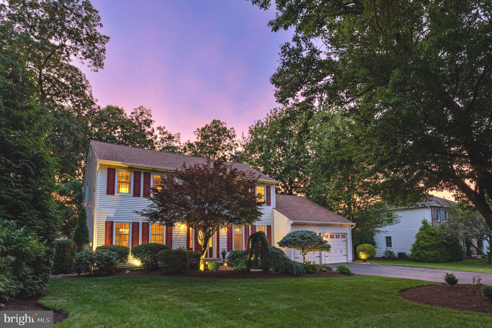 Welcome to 103 Gwynmont Circle … an elegantly updated 4 bedroom, 2.5 bath colonial nestled on a serene and private .49-acre lot in the heart of Montgomery Township. Framed by a lush tree canopy and enhanced with professional exterior accent lighting throughout, this park-like setting delivers timeless curb appeal and refined outdoor living. Step inside to discover an inviting floor plan with thoughtful upgrades at every turn. The living and dining rooms are each accented with wide plank maple hardwood floors, elegant chandeliers and upgraded millwork. You’ll love hosting formal dinners in the oversized dining room which easily accommodates seating for 8-10 guests. Love to cook? The gourmet kitchen features stainless steel appliances, including a built in gas range with air fryer & convection oven settings, Corian countertops, Italian tile backsplash, oak cabinetry with glass inserts, a charming garden window and a nicely appointed breakfast room with custom window shutters and new lantern style chandelier. Enjoy casual gatherings in the cozy family room featuring a spacious vaulted ceiling, custom palm leaf ceiling fan, brick fireplace with gas log kit, custom mantle surround and two bonus casement windows that were added by the homeowner to welcome additional light into the room. Bring the outdoors in with the double French doors which OPEN FULLY to a new maintenance-free deck (2022) with solar lights and a retractable awning—perfect for seamless indoor-outdoor entertaining. The first floor living level also boasts a powder room with updated vanity, a main floor laundry room with custom cabinetry, utility sink, new flooring (2023) and a frosted glass door … as well as a dedicated first-floor office with maple hardwood flooring and french door entry. Upstairs, the primary suite features an updated en-suite bath with glass shower enclosure, spa-style body jets, and high-end plumbing finishes. The hall bath is equally impressive with a Jacuzzi-style tub and dual sinks. All upstairs bedrooms feature neutral décor, ceiling fans and plush neutral carpet adding comfort and continuity to the entire second living level. Looking for more? The fully finished basement offers additional recreational space for the entire family … and includes fresh neutral décor, upgraded sump pit and pump and security-enhanced casement windows. Additional highlights include: new windows (2023), new roof (2012), new gutters with gutter guards (2024), new furnace (2011) with whole house humidifier, new A/C (2016), brand new hot water heater (2025) and a GENERAC whole-home generator. Newer garage doors with openers, a custom paver front walkway, upgraded front entry door with decorative glass, new shutters (2022) and a new shed (2023). The fenced rear yard also includes an irrigation system and custom patio with two gated entries. Enjoy top-rated North Penn schools, the Montgomery Township community center, local parks, lots of area shopping & restaurants, Merck, and easy access to the Septa regional rail—all just minutes away! This is a rare opportunity to own a move-in-ready home where thoughtful design and long-term care come together beautifully. Schedule your showing today!