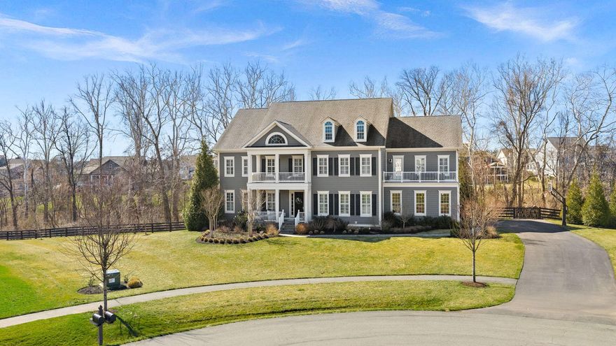 This exceptional Camberley Hamilton model is livable luxury. An extraordinary opportunity to experience luxury, privacy, and architectural presence in The Grant at Willowsford. Set on a private 1.09-acre cul-de-sac homesite, the home blends elevated architecture with modern comfort, creating expansive interiors that feel both grand and welcoming. The home’s scale and layout create multiple areas for gathering, relaxing, and hosting, while large windows invite natural light and showcase the surrounding landscape and ultimate sense of privacy

Property features you won't want to miss:
4 Seasons covered porch featuring a 2 sided fireplace plus retractable vinyl windows and retractable screens 
 
Dual staircase including curved upper and lower staircase with custom molding

Features made for living include mudroom with built-ins, oversized laundry with attached walk in linen, & ample closet space with custom shelving throughout

Primary suite with balcony overlooking the pool

Primary spa bath with freestanding tub, oversized dual vanities and walk in shower

Walkout lower level with full bar and access to covered patio and pool

Four exterior porches - unique to this elevation

Chef’s kitchen features dual islands, Subzero refrigerator, 2 dishwashers, Wolf double ovens and gas range plus a butler pantry and walk in pantry

Professionally designed and landscaped 1.09 lot by highly regarded Blue Sky