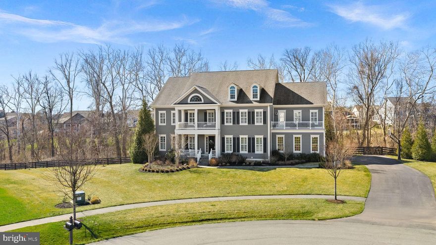 This exceptional Camberley Hamilton model is livable luxury. An extraordinary opportunity to experience luxury, privacy, and architectural presence in The Grant at Willowsford. Set on a private 1.09-acre cul-de-sac homesite, the home blends elevated architecture with modern comfort, creating expansive interiors that feel both grand and welcoming. The home’s scale and layout create multiple areas for gathering, relaxing, and hosting, while large windows invite natural light and showcase the surrounding landscape and ultimate sense of privacy

Property features you won't want to miss:
4 Seasons covered porch featuring a 2 sided fireplace plus retractable vinyl windows and retractable screens 
 
Dual staircase including curved upper and lower staircase with custom molding

Features made for living include mudroom with built-ins, oversized laundry with attached walk in linen, & ample closet space with custom shelving throughout

Primary suite with balcony overlooking the pool

Primary spa bath with freestanding tub, oversized dual vanities and walk in shower

Walkout lower level with full bar and access to covered patio and pool

Four exterior porches - unique to this elevation

Chef’s kitchen features dual islands, Subzero refrigerator, 2 dishwashers, Wolf double ovens and gas range plus a butler pantry and walk in pantry

Professionally designed and landscaped 1.09 lot by highly regarded Blue Sky