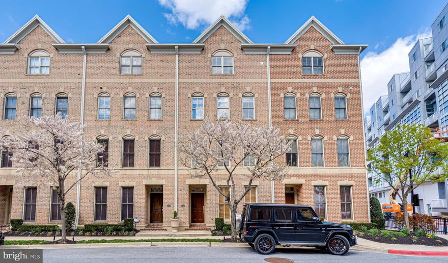 WOW.... LOOK AT THIS NEW PRICE!  Don't miss this unbelievable opportunity to own a one-0f-a-kind custom designed 4-level townhome with a 2-car garage in the gated Moorings waterfront community. The property boasts 2,880 square feet of unique contemporary space, and offers 4 bedrooms, 4 full and 1 half baths. The home is enhanced with upgraded materials, high-end finishes, designer lighting, extensive molding and ceiling detail, premium hardwood flooring throughout, 2 gas fireplaces, high ceilings, a modern metal and wood staircase, and two balconies.  On the entry level, there is a welcoming foyer, 4th bedroom with plantation shutters, and newly installed fantastic full bath. The second level provides an expansive living/dining open concept floorplan ideal for entertaining or casual relaxation. The striking gourmet kitchen with balcony access includes custom wood cabinetry with built-in drawer dividers, upgraded commercial grade stainless steel appliances, gas cooking, coffered ceiling, granite countertops, and marble flooring. A half bath is conveniently located on this floor. The third level features 2 generous-sized bedrooms, 2 full baths and a laundry room. There are numerous closets and ample storage space. The substantial primary bedroom/bathroom suite encompasses the entire fourth level. The bedroom has a gas burning fireplace with stone wall surround and opens to a balcony. The primary bath is sumptuous with heated floors, a jacuzzi soaking tub, large frameless glass shower, double vanity, and a second laundry room for added convenience. This top floor provides a special retreat for privacy and comfort. Additional features are: 2-zone HVAC with UV air purification, custom window treatments, custom closets, central vacuum, a whole-house water filtration system, Lutron lighting controls with dimmers throughout, and a security system. The Moorings is conveniently situated within steps of the Canton promenade and waterfront and within close proximity to Canton Square, Canton Crossing, the Inner Harbor, Harbor East, Fells Point, Downtown, Johns Hopkins Hospital, U of M campuses, the stadiums, train stations, and major highways. Shopping, cultural activities, restaurants, and bars are all within walking distance.