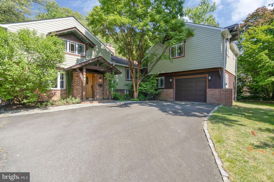 MAJOR PRICE ADJUSTMENT! ** Wonderfully unique home on .28 acre lot in North Arlington. This home has so much character and so many windows!!!  Don't miss the 3D tour! Four bedrooms, three full bathrooms.  North Arlington Schools and close in location. The original home was built in 1947; Designed by Arlington architect Kenton Hamaker, it features handcrafted knotty pine paneling, doors, and cabinetry found throughout the home. The oversized garage and gorgeous primary suite were added in 2000, with a Craftsman style blended with the original New England Revival design.  Original carriage house to the left completes the package with additional storage on ground level and a private home office with built ins and fantastic back yard views.  Huge chefs' kitchen with tons of cabinets, island, 2 sinks, granite, stainless appliances, professional grade gas range with vent hood, second oven, beverage cooler and eat in table space.  Formal dining room w/ built ins, huge living room with cathedral ceiling, wood beams, hardwoods and a wood burning fireplace.  Beautiful sunroom off the kitchen/dining rooms overlooking the stone patio and beautiful yard.  Main level also offers a bedroom and full bath as a perfect guest suite (pocket door to close it off).  2 additional upper-level bedrooms with tons of built ins (including a “ship style” bunk bed) and a full bath.  Storage/pantry/mud room off kitchen and a lower-level den completes the original home. Serene primary suite with hardwoods, 2 huge walk-in closets, cathedral ceiling w/ wood beams overlook the back yard flagstone patio and trees.   Primary bath includes soaking tub and separate shower.  Separate laundry room/mud room with walk out to back yard & easy access from garage.    Whole house & office wired for ethernet (2010), Hardywood siding (2013), Roof with 50-year shingles (2013), Upgraded lighting in kitchen & basement rec room, & new 10-yr smoke detectors (2021), Rebuilt both chimneys (2023), New hot water heater (2023), New dishwasher (2024). Plenty of driveway parking and a private, landscaped yard complete the package!