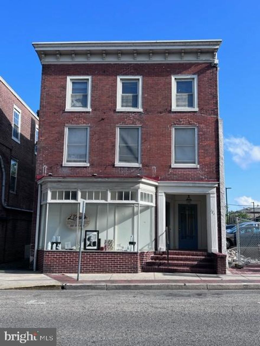Located on Main Street in downtown Elkton, Maryland, zoned C1, featuring one storefront and 2 apartment rental units (possible three unit with modifications). The storefront (Unit #1) is currently a salon, which has been in operation for many years by the same tenant. The second level apartment (Unit #2) has been remodeled, offering a one bedroom, one bath unit (currently leased). Located behind the storefront, on the main level is a 2-3 bedroom, 2 full bath apartment (Unit #3), which will require extensive renovations.  A third apartment rental potential (Unit #4) is located on the third level, also needing renovations, as well as an egress addition to bring it to building code for occupancy. Priced to give the new owner an opportunity to renovate for a successful business/investment opportunity.***PLEASE NOTE--Selling "AS IS". Seller will make no repairs or renovations. Extensive renovation will be needed to allow rental potential for 2 apartments (Units 3 and 4).  Current leases are month to month.***121 W. Main Street, Elkton, Maryland