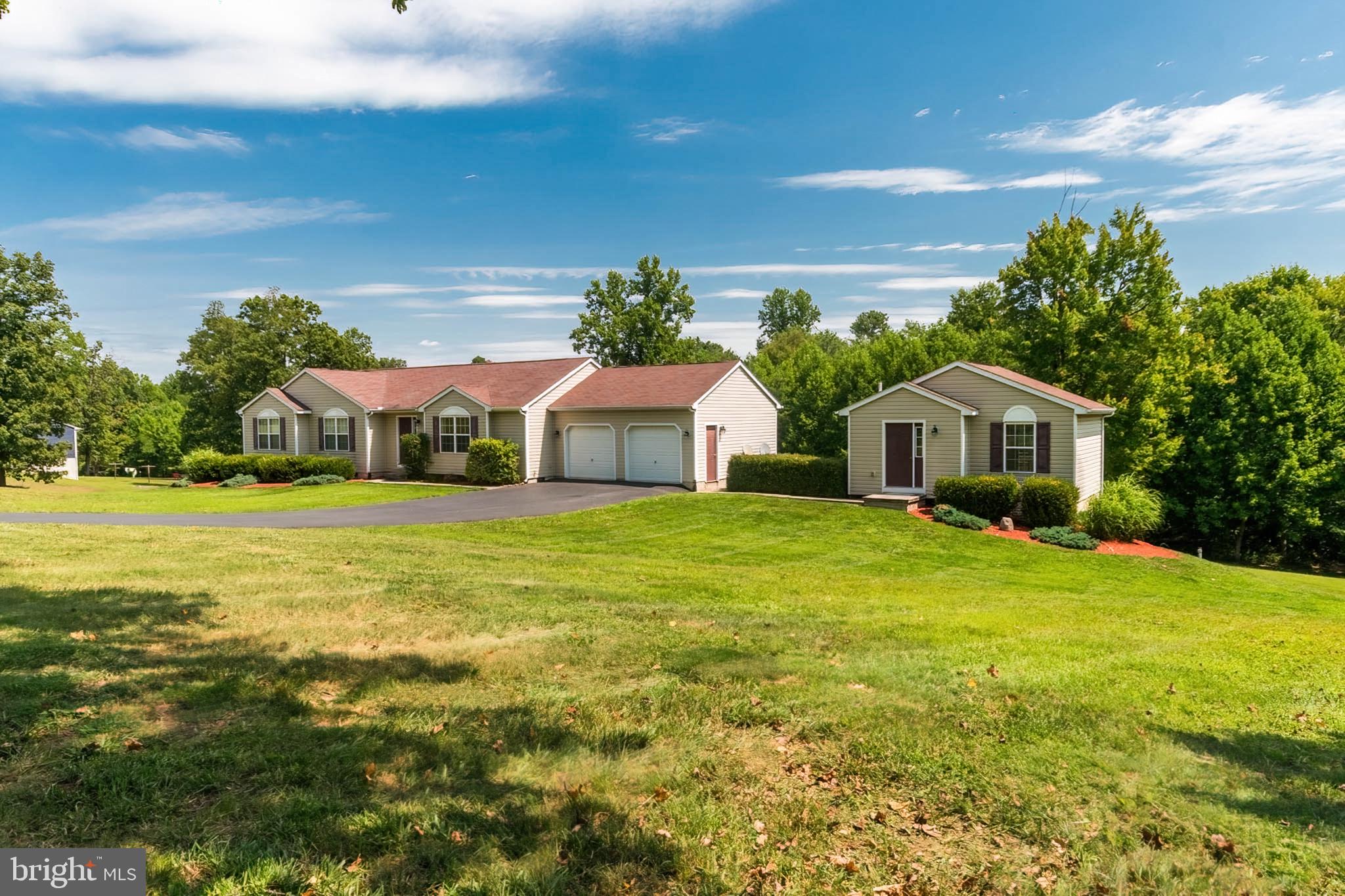 Peaceful. Privacy. Tranquility. Away from the world. If you are looking for this in your new home, look no further. This home offers all of this plus more. Six full acres, wonderful yard, large deck, PLUS. a separate guest house for family, friends, your hideaway, you name it. Call for a viewing!