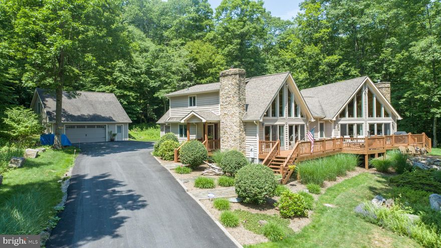 “On the Rocks” is a stunning double A-frame chalet sited on a wooded, two-acre lot in the desirable Lake Forest Estates community. This lake access home offers delightful year-round filtered lake views and is ideally situated to take advantage of Deep Creek’s four-season activities, from water sports in the summer, winter sports on the mountain, outdoor activities including hunting, fishing, hiking among many other outdoor activities this magical mountain lake setting has to offer. Meander over to your deeded boat slip or take the golf cart to carry your toys. Load up your skis and hit the slopes in a less than 15-minute drive to Wisp. Move into this complete turnkey, lake-house style 5 bedroom, 4 full bath home that’s newly decorated and ready for you and your guests to enjoy. The home has been meticulously maintained with renovations, remodels and upgrades throughout, including flooring and carpeting, window treatments and lighting fixtures. Larger remodels include the master bathroom, main bathroom, an inviting entryway, and a large over-garage bedroom suite. A recently paved driveway provides convenient access and reduced maintenance. The home’s spacious two garages offer generous space for all your toys – vehicles, golf cart, boats, ATVs and more with additional storage above the detached garage. “On the Rocks” is close to mid-lake shopping and restaurants and mid-way between the towns of McHenry and Oakland. Drive past the horse ranch and open fields on the way to this unique, enchanting property!