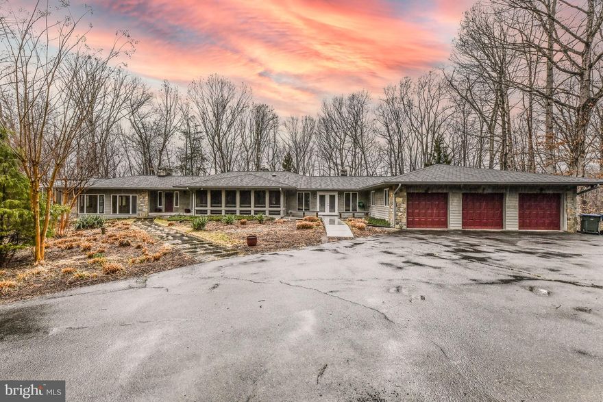 Unique 4BR, 3.5BA, 3-car garage Contemporary home with pool off private road situated on 5 wooded & landscaped acres for ultimate privacy & perfect for entertaining*Main level features two-story windows, French door walk-out, recessed lighting, elegant staircase, oak wood floors with large tiled areas, high ceilings & lots of natural light streaming throughout*Beautiful kitchen features granite counters, ample cabinetry space, large kitchen island & stainless steel appliances with butlers pantry with separate laundry/pantry also with granite counters & matching wood cabinets*Off kitchen is large powder room with stained glass window*Den on main level is open with wood flooring & doors leading to rest of home*French doors lead to large flagstone multi-level terraced patio, overlooking landscaped lot with large retractable awning*Expansive living room with wall of windows overlooking lot, recessed lighting, stone hearth wood-burning fireplace & doors leading to huge sunroom*Walking into sunroom with glass ceiling & walls on 3 sides & French doors leading to large wooden deck overlooking pool*Main level primary bedroom with walk in closets & French Doors leading to balcony overlooking pool + ensuite bathroom featuring jacuzzi soaking tub, shower, heater fan, dual sink vanity & linen closet*Additional full bedroom + full bath on main level*Lower level features additional 2 bedrooms, share full bath & 2 large rec rooms walks out to stone patio, pool & treed lot*Owners will pay for opening & closing of pool**LAWNCARE INCLUDED IN RENT*Conveniently Located less than 20 minutes to Reston (including Silver Line Metro Stations), Dulles Airport, Tysons Corner, McLean*Close to gas, groceries, shopping & dining in Great Falls Village or along Route 7*Nearby Potomac River, various country clubs, state & federal parks at Great Falls*Excellent Fairfax County Public Schools & many private schools in Virginia & nearby Maryland*

Available for lease 3.17.22*