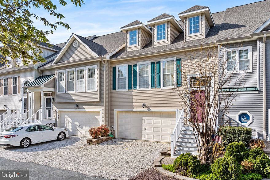 MAJOR PRICE REDUCTION makes this a BEST BUY for Ocean Pines. Don't miss this spacious three-level townhome features 3 bedrooms and 3 full baths, plus a large 3rd level loft.  Designed for comfort and flexibility. Step into the welcoming foyer, and just a few steps up, you'll find yourself on the main floor. This level offers an open-concept kitchen, dining, and  living area that seamlessly connects to both a screened porch and an open deck—ideal for relaxing or entertaining in a private setting. The adjoining kitchen keeps you connected to the heart of the home, while the primary bedroom suite provides a peaceful retreat, complete with a soaking tub and a walk-in shower.

Upstairs, a large loft overlooks the main living area, offering a versatile space perfect for guests, a home office, bedroom or an additional lounge area.

From the foyer, a short staircase leads down to the ground floor, which includes two more bedrooms, a full bath, a cozy family room, and a separate laundry room. An oversized two-car garage completes this level, providing ample storage and convenience.

Perfectly positioned near the beach, this home offers easy access to the yacht club, marina, pools, kayak storage and launch, and the golf club—inviting you to enjoy the very best of coastal living. Located within the vibrant Ocean Pines community, you’ll also enjoy scenic walking trails, parks, multiple pools, boat ramps, and a lively farmers market every Saturday. Nearby attractions such as the St. Martin’s River, Assateague Island, and Ocean City offer endless opportunities for outdoor adventure and seaside relaxation.