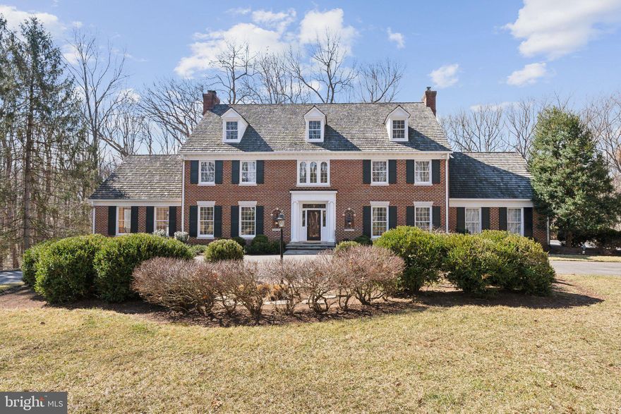 This stunning brick colonial home, situated on 11.8 acres in the picturesque Spring Meadows neighborhood, was custom-built and personally occupied by the Community's developer. As soon as you drive down the private tree lined driveway onto the impressive grounds, you will be captivated by the beautifully manicured property and spectacular wooded views. Spacious and luxurious with roughly 8,500 square feet of living space featuring 5 fireplaces, 4 large bedrooms each with en-suite bathrooms, a 4 car garage, sprawling decks and walls of windows with panoramic views from every room. The two-story marble foyer greets you with a curved staircase and beautiful architectural detail. The open concept flows from the elegant foyer to the main level rooms with soaring ceilings and impeccable grand designs and finishes. The main level features a sun filled gourmet kitchen with an oversized island, upgraded appliances, custom cabinetry and a large sun drenched breakfast room, a spectacular two-story great room with vaulted ceilings, an elegant stone fireplace and double French doors opening to the sprawling deck, a spectacular living room, a formal dining room with a fireplace, and a large study with custom built ins and an additional fireplace. Completing this impressive main level is a large half bath, a convenient laundry room, a large walk in pantry and a back staircase from the great room to the lower level den. The bedroom level offers an expansive owners' suite wing with immaculate views, a sitting room with a fireplace, a wet bar and a private balcony overlooking the breathtaking grounds. Relax in the owner’s bath with a soaking tub bathed in natural light, double vanity sinks and a walk-in glass shower. Complimenting this level are three additional oversized bedrooms, each with large closets and private bathrooms. The walk out lower level has a large den with a full wet bar, the home’s fifth fireplace and French doors leading to the back patio. The lower level is complete with a theater room, a large gym with a sauna room, three additional bonus rooms and plenty of storage. Upgraded features include New Roof (2013), Remodeled Kitchen and New Appliances (2023-2025), New HVAC Units (2017-2022), Freshly Painted (2025), New Carpet (2024). The 11.8 acre grounds, decks and patios will feel like a private retreat (with room for your future pool if you so desire) and are perfect for entertaining. Great Darnestown location in the highly sought after Spring Meadows Community walking distance to Darnestown Pool and parklands with walking, hiking and riding trails.This magnificent home is truly a must see!