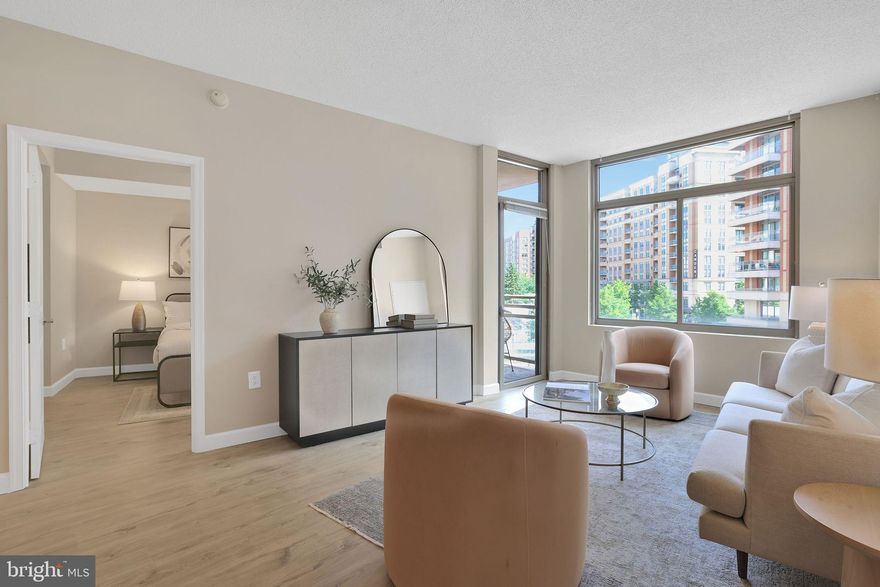 PRICE REDUCED! Step into refined living in this beautifully updated 2-bedroom, 2-full bath residence nestled in the highly sought-after Eclipse on Center Park. This sophisticated unit has been meticulously renovated to include gorgeous new flooring, a stunning modern kitchen with top-tier finishes, updated designer lighting, and fresh, contemporary paint throughout — making it truly move-in ready. On these warm spring nights, enjoy a peaceful courtyard-facing balcony, offering a quiet and serene escape despite being in the vibrant heart of Arlington. The unit’s perfect positioning ensures both tranquility and natural light, creating an ideal retreat from city life. This condo, with one of the largest floor plans in the community, includes dedicated garage parking and a private storage unit, adding convenience and value to your urban lifestyle. Residents of The Eclipse enjoy resort-style amenities, including a sparkling outdoor pool (now open for Memorial Day!), a rooftop deck with panoramic DC skyline views, a state-of-the-art fitness center, a private screening room for movie nights, a resident lounge, business center, and a 24/7 concierge for all your needs. And the best added bonus: you are in the SAME BUILDING as a Harris Teeter! Located steps from Potomac Yard, Crystal City, and Amazon HQ2, this home is a commuter’s dream. With direct access to biking and walking trails, nearby Metro stations, and minutes to DC, the Pentagon, Reagan National Airport, and countless shops and restaurants, this location is unparalleled in convenience and connectivity. Whether you're a first-time buyer, savvy investor, or seeking the perfect urban pied-à-terre, this exquisite residence offers luxury, location, and lifestyle — all in one. Don't miss your chance to own one of the most desirable units in The Eclipse. Welcome home.