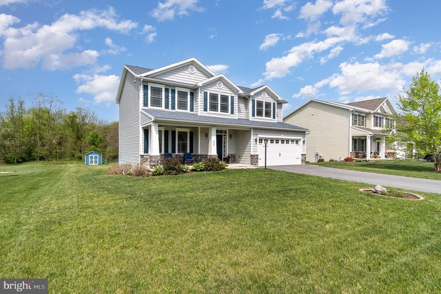 Discover your dream home situated in a serene and sought-after neighborhood. This stunning property boasts 4 spacious bedrooms, 2 full bathrooms, and 1 convenient half bath, making it perfect for families of all sizes. Enjoy the ease of access to shopping, schools, a local library, and medical facilities—all just minutes away. Imagine relaxing in your peaceful, expansive, flat backyard that backs up to lush trees and picturesque private farmland. The basement's partially finished walkout design provides seamless access to outdoor living. Entertain guests on the charming covered front porch or unwind on the spacious deck. With plenty of storage options throughout, this home is both functional and comfortable. The modern kitchen, featuring elegant granite countertops, a large island, and a pantry, is a culinary enthusiast's dream. For added convenience, the laundry room is located on the top floor, and the generous primary suite comes with a luxurious walk-in closet and a private bath. Don't miss this opportunity to call this remarkable property your home!