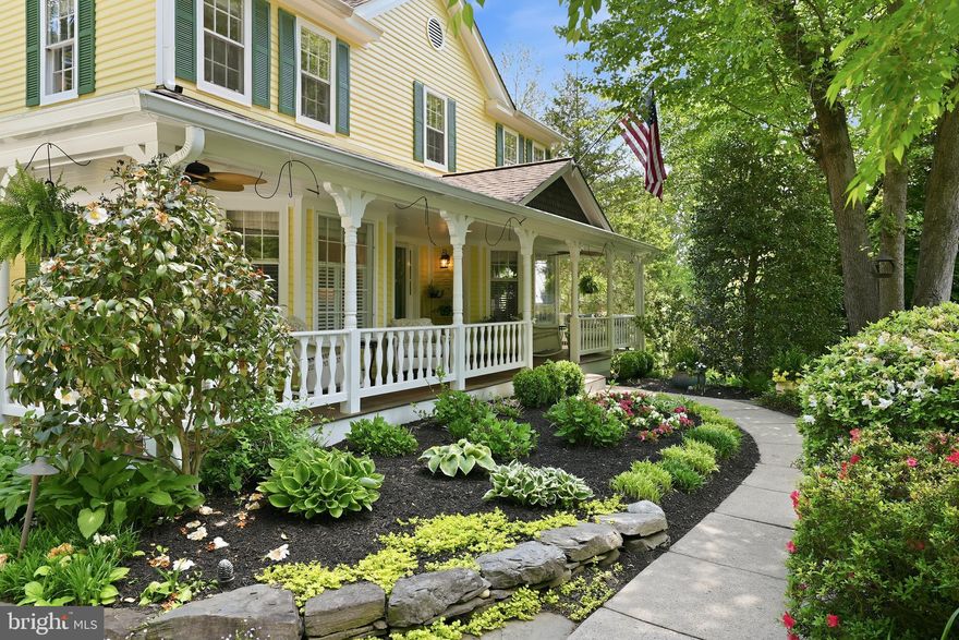 Tucked quietly at the end of a serene cul-de-sac in Vienna’s coveted Colvin’s Glen community, 10204 Yellow Pine Drive is a rare offering where timeless architecture, extraordinary craftsmanship, and an unrivaled natural setting converge. Set on more than half an acre with no HOA and originally built as the builder’s own personal residence, this estate backs directly to the protected woodlands and trails of Colvin Run Mill Park, creating a setting of privacy and serenity just minutes from Tysons, Reston, and major commuter routes.

Offering roughly 4,200 finished square feet across three levels, the home features 5 bedrooms, 3 full baths, and 1 half bath. Victorian and farmhouse influences shape the exterior, highlighted by a sweeping wraparound porch with freshly coated IPE flooring, tongue and groove pine ceilings, and a rare semi-attached 3-car carriage garage with newly replaced carriage doors.

Inside, sun-filled spaces are rich with warmth and character. Refinished hardwood floors, extensive millwork, deep bay windows, formal living and dining rooms, and multiple thoughtfully curated spaces designed in collaboration with award winning Susan Kuehhas of SK Interiors create a home that feels both elegant and deeply livable. The renovated kitchen offers custom cabinetry, marble counters, Bosch and KitchenAid appliances, apron front farmhouse sink, bar seating, and a light-filled breakfast room with built-in banquet seating. A beautifully tailored main level office adds another standout design moment.

At the heart of the home is an extraordinary two story historic Staunton, Virginia log cabin seamlessly integrated into the residence, creating a one-of-a-kind family room and primary suite with exposed beams, pegged pine floors, stacked stone fireplaces, reclaimed wood mantels, and authentic character rarely found.

Upstairs, the spacious primary suite is paired with a marble spa bath featuring skylights, jetted soaking tub, frameless glass shower, walk-in closet, and built-in vanity. Three additional upper bedrooms, renovated hall bath, and upper level laundry add everyday convenience.

The walk-out lower level offers exceptional flexibility with guest or nanny suite, full bath, wet bar, recreation and fitness spaces, built-ins, and direct access to the rear grounds.

Outside, professionally curated gardens by Sisson Landscapes and River’s Edge Landscapes create a lush, private retreat. Resort-style amenities include a heated in-ground pool with integrated spa, expansive multi-tier decks, screened porch, fire pit patio, standalone hot tub beneath pergola, outdoor shower, play area, basketball hoop, stone paths, and irrigation system.

Zoned to nationally ranked Langley High School, Cooper Middle School, and Colvin Run Elementary, this is a home of uncommon beauty, privacy, and soul.