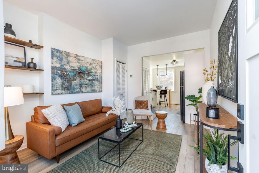 Welcome to this charming 3 story rowhome in the vibrant Olde Kensington neighborhood within blocks of Northern Liberties and Fishtown. As you enter the cozy family room with open shelving built-ins and ambient sunlight, you’re greeted with a newly renovated kitchen featuring a gas range, prep area, modern finishes, and a custom wood peninsula perfect for entertaining, working, or enjoying a meal. Continuing through the outside to the private backyard, it’s tough to find a larger outdoor space in the city than this one that is 23’ deep. Featuring Trex deck with room for both a dining table and outdoor conversation seating. Moving upstairs, you’ll find one bedroom and a newly redone bathroom on the other side with a built-in linen closet. The sharp tile selections provide a clean feel with plenty of storage in the warm wood tone vanity and double sink. Moving to the third floor, you’ll find two ample sized bedrooms. Every room is flooded with natural light because of a wide street in front that includes street parking on both sides, and a beautiful park behind the house for non obstructed scenic views. Over the last few years, almost everything has been newly installed for reduced future maintenance (including: central AC, bathroom & kitchen, flooring, windows, exterior doors, basement french drain, deck, water heater, range, and dryer). The location makes commuting easy with proximity to Girard Station (MFL) and access to both 95 & 76. You'll also be steps from the extrandority food, drinks, and entertainment scene of Fishtown & Northern Liberties.