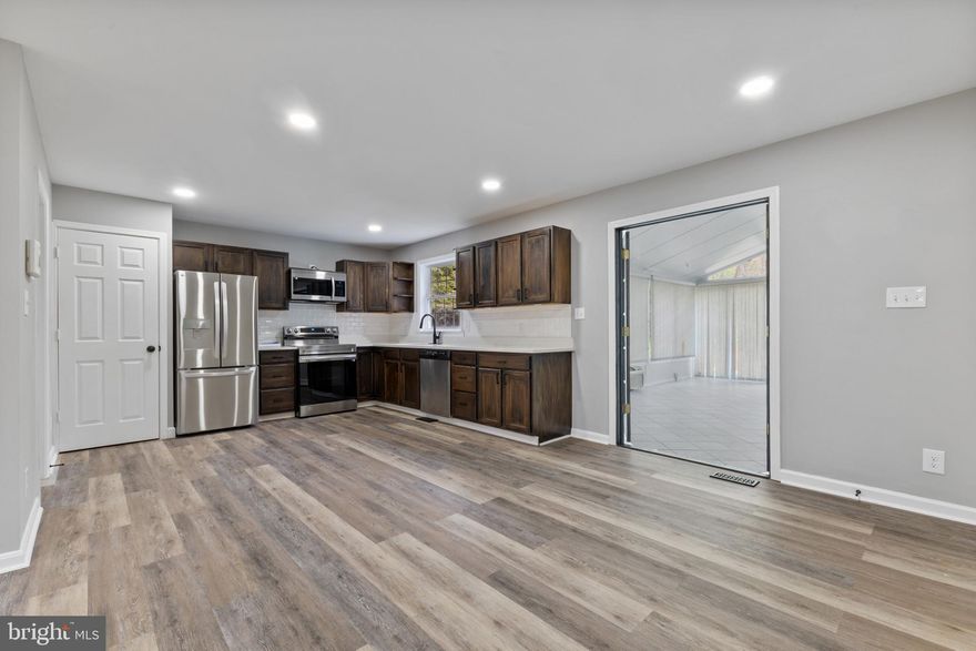 Stunning Fully Renovated Home on 1.5 Private Acres – A Rare Find!

Discover this beautifully updated two-level home, privately nestled on 1.5 acres of peaceful land. Step inside to find a spacious and light-filled layout with endless flexibility, including a bright walk-out basement featuring its own full kitchen and laundry—ideal for extended family, guests, or multi-use living.

On the main floor, the original home offers 3 comfortable bedrooms and 2 full baths. The real showstopper is the expansive 24’ x 24’ vaulted-ceiling sunroom—perfect for relaxing or entertaining. This versatile space is smartly divided into two 12’ x 24’ rooms, one of which could easily serve as a second primary suite or handicap-accessible bedroom with its own private living area.

Downstairs, the sunny lower level opens up even more possibilities: home office, playroom, homeschool classroom, hobby space—you name it!

Outside, enjoy a brand-new 24’ sundeck for soaking up the sun, a covered front porch for relaxing, two sheds/workshops, and even a greenhouse for gardening enthusiasts. There's ample parking for vehicles, guests, or even recreational toys.

This fully remodeled property combines comfort, privacy, and versatility in one amazing package—and it’s an opportunity you won’t want to miss!