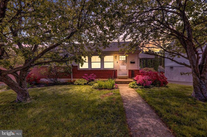 OPEN HOUSE WEDNESDAY 5/21 5PM - 7PM and SATURDAY 5/24 12PM - 2PM.  Welcome to this renovated, move-in ready gem in the heart of the desirable Wilson School District! This stylish one-floor home offers the best of both comfort and convenience, featuring low property taxes, gas heat, and central A/C throughout. Step inside to find refinished hardwood floors, new windows, oversized baseboards, updated doors and hardware, and custom wainscoting that adds timeless charm.

The spacious layout includes a sun-filled living room, large dining room, and an expansive galley kitchen with double oven, perfect for entertaining. The beautifully updated bath and generously sized bedrooms provide modern comfort, while the attached garage and main-level living make this home ideal for those seeking easy access with no stairs.

Outside, enjoy a private yard with a firepit, basketball hoop, shed, and side patio with grill space -- an entertainer's dream! Bonus potential exists in the basement with the option to add a third bedroom or create a fun hangout area.