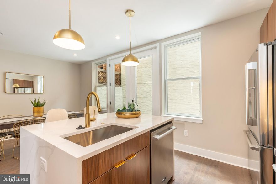 Located in the heart of Bella Vista, CIN-QUE is a luxury new construction development by Philadelphia’s
premier developer Lily Development. CIN-QUE features 5 stunning homes, each with over 2,800 SqFt of
living space, 4 bedrooms, and 4.5 bathrooms. The facades brickwork has incredible detailing and tons of
windows which allows natural light to flow through the entirety of the home. Upon entering the home, you
walk into an open and spacious living room with dramatic ceiling height, which leads to a gourmet kitchen
with a large island, plenty of countertop and cabinet space, and room for a dining table. The rear wall in the
kitchen has glass sliding doors that lead to an oversized outdoor patio, making this the perfect space for
entertaining during all seasons. The second floor features a large bedroom with a full bathroom and walk-in
closet, along with a loft area with glass railings that overlooks the living room. The third floor features two
large bedrooms with ample closet space and private full bathrooms for each bedroom. The fourth floor is
your entire owner’s suite. It has a private full bathroom with impeccable detail work and finishes, two walkin closets, and an outdoor green space. Outside of the owner’s suite, there is a wet bar located off the
private roof deck. Each of these homes has been thoughtfully designed and includes 9' ceilings throughout,
oak hardwood floors, 400 series Anderson windows, Nest thermostat, Ring doorbell, contemporary kitchens
with Signature Kitchen Suite stainless steel appliance packages, custom cabinetry with under cabinet
lighting, and stunning quartz countertops. In the heart of Bella Vista, CIN-QUE is located just steps from
Cianfrani Park, Society Hill, Washington Square, and a short walk to some of the best restaurants and
shopping destinations that the city has to offer. One year builder's warranty included and 10 year tax
abatement pending. Builder is providing one car prepaid parking for one year. Builder offers a special
developer's mortgage program with a rate lock from Univest Bank. Photos are of the Model Home (930 S
Beulah). Taxes and square footage is the responsibility of the buyer to have verified.