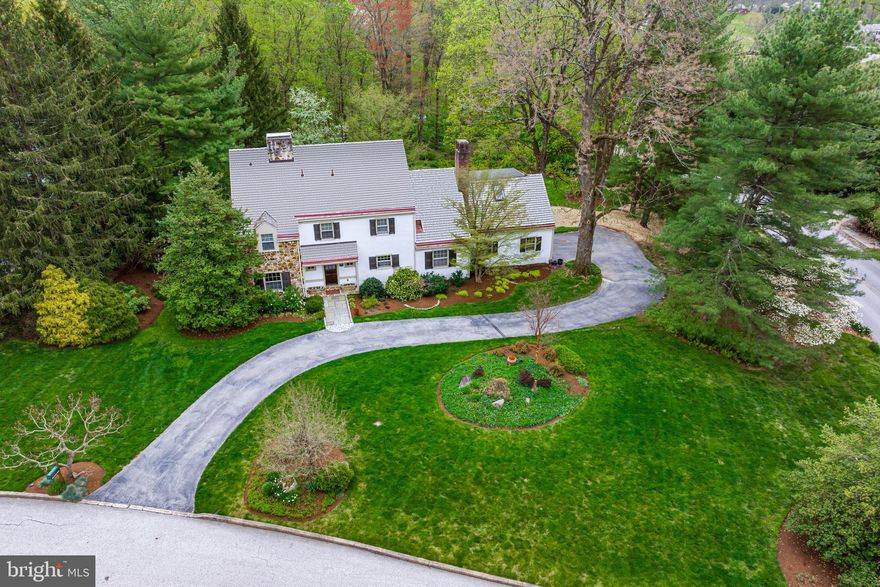 Look no further and move right into this beautiful, sun-filled home, with stunning views of the breathtaking grounds and gardens from every turn. Located on a quiet cul-de-sac, close to renowned TE and private schools, it also offers proximity to endless recreational and equestrian facilities, golf courses, hiking and biking trails, trains, restaurants, shopping and more. Features include stunning hardwood floors  throughout the entire home, a spacious front to back foyer, gracious living and dining rooms with bright windows looking over the private backyard and patio, charming library, inviting cherry kitchen opening up to the spacious family room, convenient mudroom with laundry, fabulous primary suite with luxurious bath and en-suite balcony access, expansive second bedroom suite with en-suite bathroom, 2 additional large bedrooms with a third full hall bathroom, walk up third floor and a dry basement for future expansion, if desired.