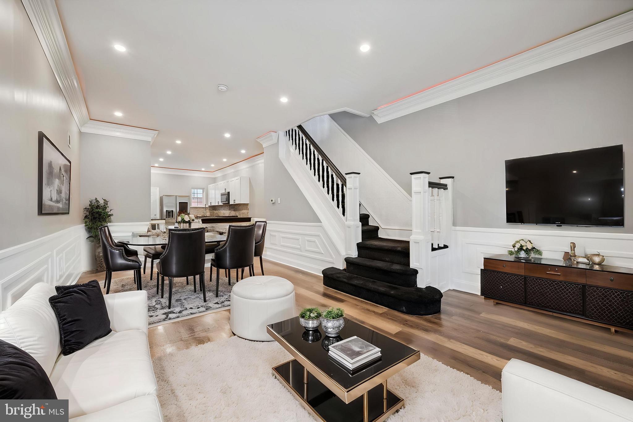 Welcome to your dream home in the vibrant and growing Hartranft neighborhood of 19133! This fully remodeled 3-bedroom, 1.5-bath single-family residence seamlessly blends modern elegance with thoughtful, high-end design. Step into a bright, open-concept layout that’s flooded with natural light... perfect for both entertaining and everyday living. The sleek, modern kitchen flows effortlessly into the spacious living and dining areas, creating a cohesive and stylish main floor. LED lighting accents in the living room add a touch of contemporary sophistication, elevating the ambiance with the push of a button. The fully finished basement provides valuable additional living space and includes a washer and dryer for everyday convenience. Enjoy year-round comfort with central air and a smart layout that maximizes both form and function. Upstairs, retreat to your private suite where the bedroom opens directly onto a full private deck, creating a balcony-style oasis that feels like a personal getaway. This unique feature brings in a serene, elevated indoor-outdoor living experience that’s RARE to find in the area. Step outside and be wowed by a one-of-a-kind backyard... meticulously landscaped with charming details and even a swing, making it an inviting haven for entertaining, relaxing, or letting the kids play. This outdoor space is truly a standout, offering both beauty and function in equal measure. Perfect for families, first-time homebuyers, or investors looking to add a standout rental to their portfolio, this property is move-in ready and FHA-friendly. Eligible for first-time buyer programs and down payment assistance, this home combines luxury with accessibility. Located near schools, parks, public transportation, and all the development happening in Hartranft, this is a rare opportunity you don’t want to miss.