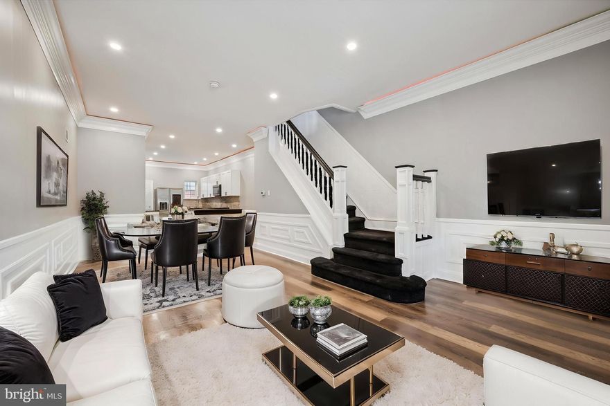 Welcome to your dream home in the vibrant and growing Hartranft neighborhood of 19133! This fully remodeled 3-bedroom, 1.5-bath single-family residence seamlessly blends modern elegance with thoughtful, high-end design. Step into a bright, open-concept layout that’s flooded with natural light... perfect for both entertaining and everyday living. The sleek, modern kitchen flows effortlessly into the spacious living and dining areas, creating a cohesive and stylish main floor. LED lighting accents in the living room add a touch of contemporary sophistication, elevating the ambiance with the push of a button. The fully finished basement provides valuable additional living space and includes a washer and dryer for everyday convenience. Enjoy year-round comfort with central air and a smart layout that maximizes both form and function. Upstairs, retreat to your private suite where the bedroom opens directly onto a full private deck, creating a balcony-style oasis that feels like a personal getaway. This unique feature brings in a serene, elevated indoor-outdoor living experience that’s RARE to find in the area. Step outside and be wowed by a one-of-a-kind backyard... meticulously landscaped with charming details and even a swing, making it an inviting haven for entertaining, relaxing, or letting the kids play. This outdoor space is truly a standout, offering both beauty and function in equal measure. Perfect for families, first-time homebuyers, or investors looking to add a standout rental to their portfolio, this property is move-in ready and FHA-friendly. Eligible for first-time buyer programs and down payment assistance, this home combines luxury with accessibility. Located near schools, parks, public transportation, and all the development happening in Hartranft, this is a rare opportunity you don’t want to miss.