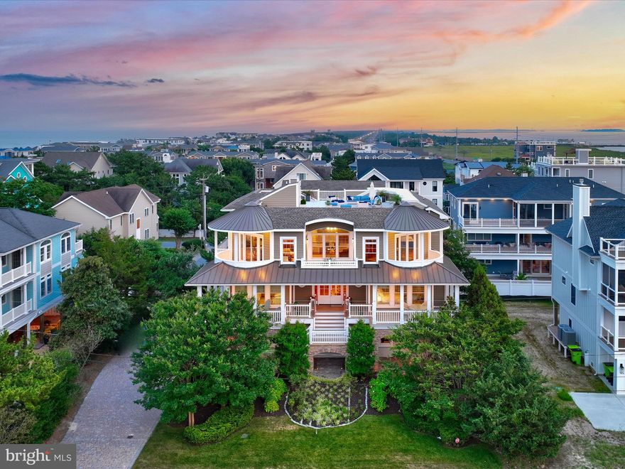 This exquisite property offers a one-of-a-kind coastal living experience that you won't want to miss. Located in North Indian Beach, just south of Dewey Beach, this home boasts a prime location with access to private and pristine beaches, breathtaking ocean views, and a serene atmosphere.

Prepare to be captivated by the grandeur and design of this residence. Thanks to the advantageous 42-foot height limit, you can enjoy unobstructed views that overlook the neighboring homes in Dewey Beach. As you step outside, you'll find the private beach within walking distance, allowing you to easily soak up the sun and enjoy the sand and surf. Additionally, the proximity to Rehoboth Bay Marina, located at the end of the street, enhances the coastal lifestyle this location offers.

This exceptional coastal retreat spans approximately 7,000 square feet of conditioned space. Constructed with durable, quiet, and super energy-efficient ICF construction, as well as hurricane-rated windows, this home provides unparalleled comfort and peace of mind. Situated just 600 feet away from the Atlantic dunes and 675 feet from the Rehoboth Bay, it's an ideal location for beach and water enthusiasts.

One of the standout features of this property is its expansive rooftop deck, offering 360° stunning views of the surrounding beauty. Upon entering the home, you'll be greeted by a grand see-through entry foyer and high ceilings throughout. An elevator provides easy access to all floors, including the main living areas on the third floor.

Designed for grand-scale entertaining, the open floor plan encompasses a spacious custom kitchen with dual islands, luxury appliances, and a folding window that connects to the generous screened porch. Here, you can enjoy indoor/outdoor dining and entertainment. The adjacent open concept dining area and living room create a seamless flow for gatherings. For added privacy, a den/TV room can be closed off, and a gas fireplace in the living room adds warmth and ambiance.

Heading to the second floor, you'll find a grand stairway and a covered front porch spanning the width of the home. The luxurious master suite features a walk-in closet, an elegant bathroom with a whirlpool tub, and an indoor/outdoor shower. Two ensuite guest bedrooms offer comfort and privacy, while a third guest bedroom and adjacent kid's room share a jack and jill bath. Additionally, there is a laundry closet and a private reading deck for moments of tranquility.

The first floor of the home includes an additional guest bedroom and a half bath, as well as a spacious bonus space that can be customized to your liking. Whether you prefer a home gym, a home office, or additional bedrooms and bathrooms, the possibilities are endless. This level also features a second living/TV area, billiard and ping pong tables for entertainment, and two entry doors from the garage, one of which conveniently connects to the elevator.

Further highlights of this exceptional property include hardwood flooring throughout the second and third floors, exquisite trim features, solid interior doors, a high-velocity HVAC system, a security system, and an automatic water shutoff system. The large two-car garage provides ample storage space, while the tankless water heater ensures efficient resource usage. Multiple decks offer additional outdoor space, and the paver driveway can accommodate up to 10 cars for parking convenience. Dual outdoor showers and an outdoor toilet add convenience after a day at the beach.

Immerse yourself in luxury coastal living at its finest in this remarkable home, where thoughtful design and top-notch amenities combine to create an unparalleled living experience. Don't miss your chance to own a piece of heaven in Dewey Beach!
