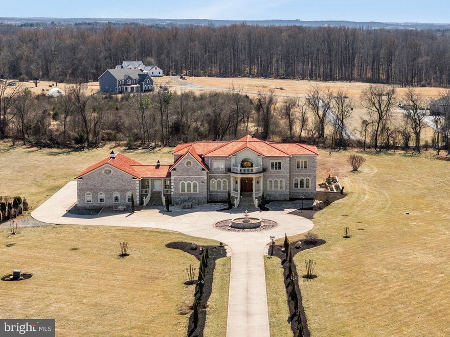 JUST LISTED!!  RARE, DISTINCTIVE and REGAL MEDITERRANEAN MANSION on a PICTURE PERFECT 10 acres!  Located in PICTURESQUE Haymarket, VA Only 40 miles west of Washington DC…this GATED 10,000+ SQ.Foot. CUSTOM BUILD inspired by European architecture and nestled at the end of a PRIVATE cul-de-sac  w/ POND and MAGICAL SUNSETS!  This SLICE of PARADISE offers 6 Bedrooms and 7.5 Baths featuring all upper-level bedrooms on-suite..  AMAZING Opportunity for MULTI-GENERATIONAL Living and LAVISH Entertaining for Family Gatherings and Guests.  NO EXPENSE was spared during construction (NOTE: This property cannot be built anywhere near this List Price) – the highest quality CRAFTSMANSHIP and DETAILED Fine Metal and Wood Trimmings throughout all 3 levels. 
 
Enter through the majestic front gate onto a 400-foot Italian Cypress tree lined driveway leading up to the “ENDLESS WONDERS MANSION,” a testament to intricate construction and design.  A captivating Italian fountain, the centerpiece of the circular drive and motor court welcomes your visitors with its soothing sounds.  Beyond the hand carved arched double doors discover the DRAMATIC GRAND foyer w/ marble floors adorned with intricate mill-work, beamed ceiling, wrought-iron railings, double curved staircase and STUNNING crystal chandelier.  The OPEN CONCEPT includes a 2-Story GREAT ROOM w/ ornamental hand carved gas fireplace and third staircase to the upper-level living quarters.  All Silk Custom Window Treatments convey.  The centerpiece of the main living level is a chef’s kitchen, a culinary masterpiece w/  SS appliances including gas cooktop w/ exhaust hood, double wall ovens, built-in microwave, warming drawer, custom cherry cabinetry, and a SPACIOUS CENTERPIECE GRANITE island overlooking sunroom w/ scenic views and eat-in areas. Adjoining the kitchen is a versatile 2nd food prep / staff kitchen.  A separate and distinguished EMBASSY Sized Formal Dining Room is perfect for hosting family dinners or corporate events.  Additional main level living spaces includes Bedroom/Home office, full bath w/ soaking tub, ½ bath, laundry suite and PEACEFUL Side Conservatory w/ coffered ceilings, ornamental hand carved marble gas fireplace and wall of windows overlooking scenic vistas.  There are Multiple outdoor coves and romantic balcony’s w/ terracotta tiled floors accessible from the main level.  
 
The Upper-Level living quarters include 4 LUXURIOUS Bedroom Suites w/ sitting area and walk-in closets.  Each connected full bathroom includes floor-to-ceiling designer tile work.  The finished walk-out Lower Level is perfect for so many options…from hosting charitable fundraisers, family milestone events, wedding in the lower level EVENTS/BALL ROOM w/ full wet bar rough-in.  Additional REC ROOM/PARLOR w/ 3rd custom stone fireplace, 7th legal bedroom or Home Based Business office w/ Full Bath.  Home Theater Room w/ pre-wired surround sound, future wine cellar room, and additional storage space.  Home also features a 3 Bay – 5 Car In-Tandem Garage w/ 50+ Foot Ceilings.  Plenty of room for lifts and car collector enthusiasts.  Buyer Peace-of-Mind:  Pre-Listing Home Inspection and Full Septic Inspection completed prior to listing.  Don’t let this ONE-of-a-KIND OPPORTUNITY to OWN the "ENDLESS WONDERS MANSION."  4362 High Ridge Road is ready for you to call HOME!