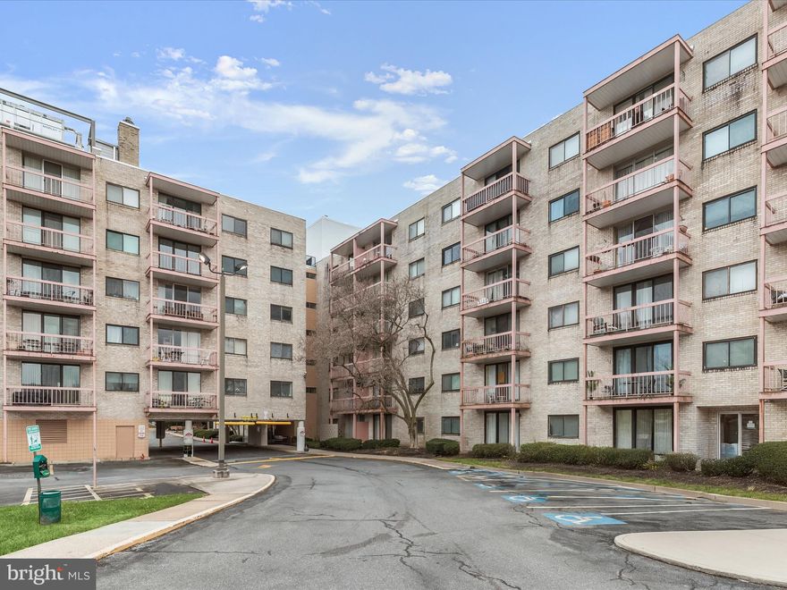 Welcome to 130 Slade Avenue, a mid-rise condominium in Pikesville that offers a secure entrance with a doorman, concierge services, elevators, an outdoor pool, reserved parking and more. Located on the second floor, this inviting unit offers two bedrooms and two full bathrooms. As you enter inside the unit, you are greeted by abundant natural light through the oversized sliding glass doors in the living room that open to the private balcony. The dining area boasts hardwood floors and the kitchen features a new stainless steel electric range. At the end of the hall, the primary bedroom includes a walk-in closet and a private ensuite bathroom with a walk-in shower. The second bedroom is conveniently located across the hall from the second full bathroom that has a tub shower. Finishing the unit are several hall closets that provide storage space. Additional community amenities include an outdoor pool for summer enjoyment, common laundry rooms on each floor, and the monthly condo fee covers water, sewer, trash, snow removal, and one reserved parking spot. Centrally located just minutes away from Reisterstown Road, Park Heights Avenue, I-695, I-795, and the Metro SubwayLink Milford Mill Station, offering easy access to nearby shopping, dining, and entertainment and more. Note that this condo is for owner-occupied purchases only; the condo does not permit new rentals.