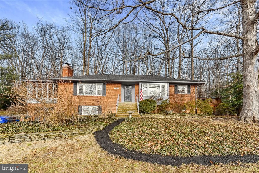 Classic solid brick rambler in Old Hillandale has been with the same owners for almost 40 years. Set in a community of custom homes in a park like setting, the neighborhood features mature trees and tons of azaleas. The home was built with loving care and features the touches that you just can't find in a newer home. The kitchen was modernized and leads out to a large custom deck.  On the main level are three bedrooms all with fine oak floors. The master bedroom with bath has a door that exits to the sunroom. The home also features a large formal living room with a fireplace and another doorway leading to the sunroom. The sunroom is very large with high quality windows and heat so that it can be used year round.  The garage features an entrance to the lower level of the house which is fully finished with a rec-room with fireplace, a large custom office and a large additional room.  Hillandale features two community pools that  are open in the summer. In addition Hillandale Park is undergoing a major multi-million dollar renovation and will be "state of the art" when completed next year. The location is convenient to the beltway and route 95N. You are also only about a 15 minute drive from downtown Silver Spring and about 20 minutes to the College Park campus of the University of Maryland.