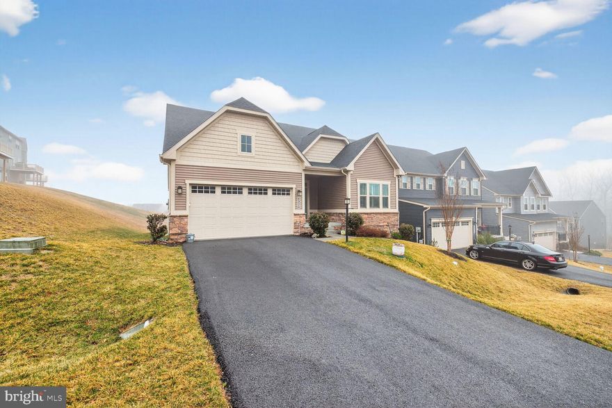 New Price!!!! Compare this price  with similar inventory!! Discover effortless main-level living in this pristine, like-new 2023 Ryan Homes Bramante Ranch model, perfectly situated in the amenity-rich Hamptons neighborhood at Lake Linganore. With over 1,600 sq ft on the main level and a fully finished walkout basement adding even more versatile space, this home delivers spacious, sunlit open-concept design and premium upgrades throughout. Step inside to a welcoming foyer and convenient arrival center off the two-car attached garage. The main level offers a dedicated office/flex room, two full baths for ultimate convenience, and a luxurious owner's suite featuring a tray ceiling, walk-in closet, and an en-suite bath. The expansive gourmet kitchen is equipped with an oversized island, eat-in area, quartz counters, beautiful cabinetry, and seamless flow to the family/dining spaces. Enjoy indoor-outdoor living via the great covered porch off the kitchen, which opens to an expansive low-maintenance deck—ideal for entertaining. Durable LVP flooring flows throughout the main areas, with plush carpet in the bedrooms for added comfort. Downstairs, the finished walkout basement offers a huge recreation room, plenty of storage, and a generous third bedroom with full bath—perfect for guests, a home gym, or media room. Additional highlights include a tankless hot water heater for efficiency and endless modern touches. Residents enjoy all that Lake Linganore has to offer: picturesque lakes for boating and fishing, multiple pools, lakeside beaches, nature trails, outdoor athletic courts, playgrounds, and community events. Commuting? No problem - easy access to major highways and MARC train.  Top-ranked Frederick County Public Schools! Take advantage of nearby public and private golf courses, downtown Frederick - plus convenient shopping, dining, for a special occasion or your everyday essentials. This move-in-ready gem in a resort-style community with no city taxes is truly a can't-miss opportunity—don't wait to make it yours!