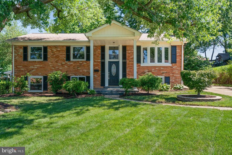 Welcome home! This beautiful property has been exquisitely remodeled from top to bottom. As you arrive the extra-long driveway gives room to park multiple cars. As you enter you will find an open floor concept with solid hardwood flooring on the main level. The new gourmet kitchen has quartz countertops, stainless steel appliances and an eat-in island. The house also offers an addition on the back which can be used as an office, seating area, etc., The extra-large master suite offers a walk-in closet and an updated master bathroom with double vanity and standing shower. On the lower level you will find a large family room with a woodburning fireplace for ambience and comfort during the cold months.  A third bathroom on the hallway two additional bedrooms and the large laundry room which offers ample storage space and a door to access the fully fenced backyard. Large shed conveys. This home will not last. Must See!