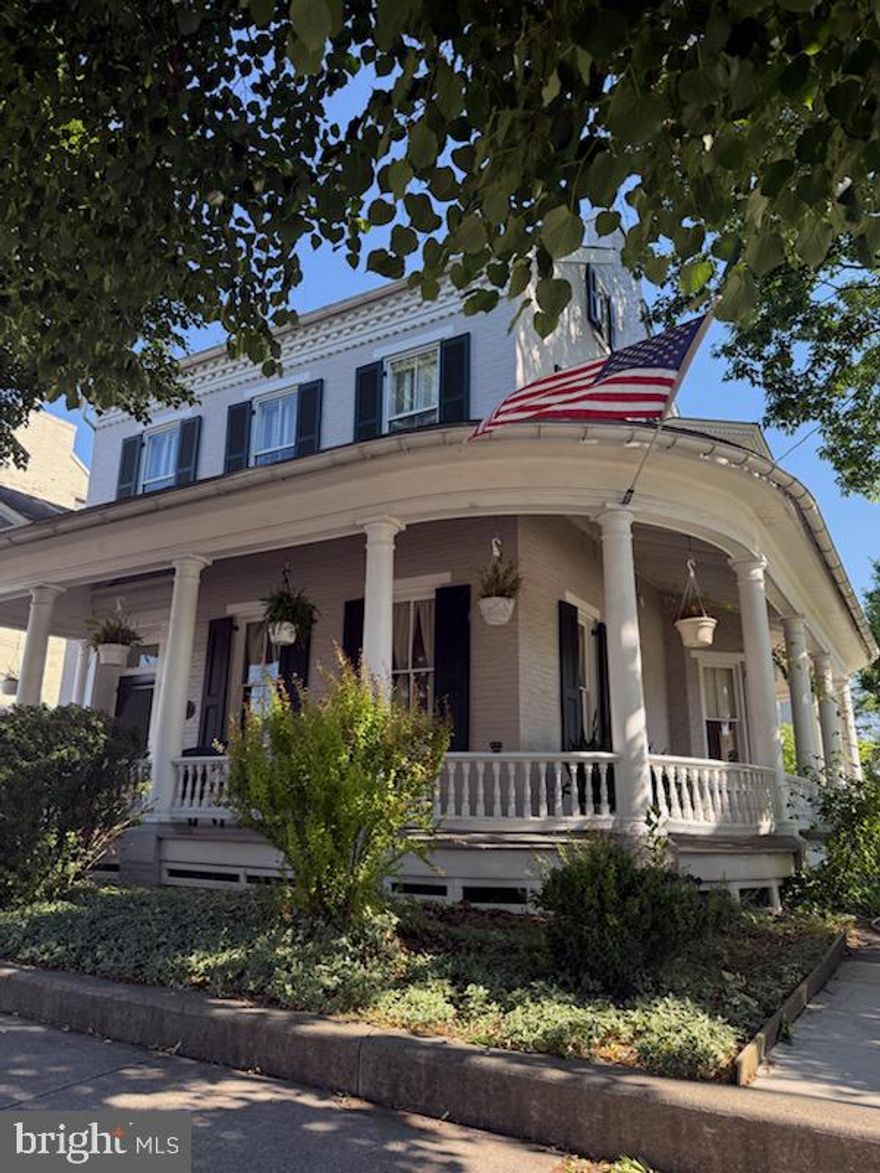 Welcome to 13 W Main Street, a stunning Victorian residence that blends timeless craftsmanship with a lifestyle that’s increasingly hard to find. With 4 bedrooms, 2.5 baths, and iconic curb appeal,  this home is a true centerpiece of Mount Joy’s historic downtown.

The exterior immediately captivates with its wraparound porch and a striking turret, setting the tone for the architectural detail found throughout. Inside, you’ll discover intricate wood craftsmanship, tall ceilings, and large windows that flood the home with natural light—each room offering its own sense of character and warmth. The parlor is adorned with tall windows and a gas fireplace, the kitchen blends function with charm, offering abundant cabinetry, stainless steel appliances, a gas cooktop, and Corian countertops. Adding to the home’s authenticity is a second staircase, a hallmark of homes from this period that enhances both character and practicality.

Leading upstairs, the layout continues to impress with a split landing to easily access all well-proportioned bedrooms and access to a charming second-floor balcony, perfect for quiet mornings or evening relaxation. The second floor features 2 full bathrooms and access to a 3rd story with a very large unfinished attic that could serve as additional future space.

One of the most unique highlights is the unmatched walkability. The Mount Joy Amtrak Station is just one block away, recently upgraded and modernized, offering a seamless commute on the keystone corridor to Lancaster, Harrisburg, Philadelphia, and beyond. Whether you’re a daily commuter or someone who values easy access to major cities without sacrificing small-town charm, this location delivers. Combine this amenity with quick access by rail to Harrisburg International airport and you can travel anywhere in the world by just walking up the street.

Access to the back yard can be made through the kitchen or any of the several doors along the wrap around porch. The backyard features a sidewalk leading to a detached garage with additional paved parking adjacent to the garage.

From the craftsmanship and architectural presence to the unbeatable proximity to rail transit, 13 W Main Street offers a rare opportunity to own a home that’s as functional as it is beautiful—where history, convenience, and lifestyle intersect. This certified home listing includes the following reports: All of this has been completed utilizing a certified home listing plan which includes: Home Inspection, Termite Inspection, Radon Inspection and an appraisal. Ask your agent or the listing agent about being able to close in 10 days.