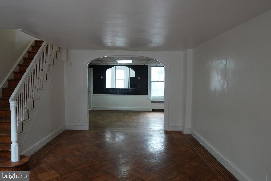 Welcome to 1980M Penfield Street, a charming Philadelphia rowhome offering great potential and classic city appeal! This spacious home features a bright kitchen with large windows that fill the room with natural light, warm wooden cabinetry, and a functional layout that’s perfect for daily living or entertaining. The adjoining dining and living area offers an open feel, highlighted by vintage architectural details like an arched wall cutout and high ceilings that give the space character and flow.

The full bathroom showcases a retro tile design with updated fixtures, blending old-school charm with modern convenience. Each room provides a blank canvas ready for your personal touch, making this home ideal for first-time buyers, investors, or anyone looking to customize their own space.

Located on a quiet block in West Philadelphia, this home offers easy access to public transportation, local shops, and nearby parks. Don’t miss the opportunity to bring your vision to life in this well-maintained property full of potential and personality!