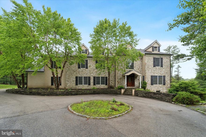 This impressive 8,000+ square foot home offers a perfect blend of timeless elegance and modern functionality. Step inside to a spacious tiled entryway flanked by beautiful hardwood floors, setting an inviting and refined first impression.

With five generously sized bedrooms — including a versatile in-law, guest, or au pair suite in the finished walkout basement — plus five full baths and two powder rooms, this home delivers exceptional space and flexibility for today’s lifestyle.

The formal living room, complete with a gas fireplace and tray ceiling, provides a serene view of the beautifully landscaped front yard. The adjoining formal dining room connects to the gourmet kitchen through a butler’s pantry — ideal for entertaining. In the kitchen, you’ll find abundant counter space, modern appliances, and room to gather. A cozy family room and a spacious home office complete the main level, offering comfort and convenience.

Upstairs, the primary suite serves as a true retreat, featuring a sitting area, luxurious full bath, and an expansive walk-in closet. The finished walkout basement adds four additional flexible spaces — perfect for a gym, media room, or playroom — along with the in-law/guest suite for extended stays.

Step outside to enjoy a private enclosed rear yard and expansive side yard, ideal for outdoor entertaining, play, or relaxation. The attached three-car garage and circular driveway provide ample parking and storage, while the composite faux slate roof adds enduring beauty and quality. Inside, three separate heating zones ensure comfort and efficiency throughout every season.

Located near top-rated public and private schools, this home offers easy access to major highways and is close to shopping, dining, and everyday conveniences. Don’t miss the opportunity to make 1 Dunminning Road your forever home.