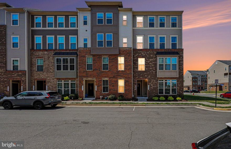Premier end-unit, top-level townhome-style condo—one of the best-located homes in Loudoun Crossing. Combining end-unit privacy, top-level living, and a standout position within the community, this home offers advantages rarely found in similar models. Extra windows bring in abundant natural light, while the quiet street setting is just steps from the playground. Enjoy sunset views over a peaceful, tree-lined setting from the balcony off the kitchen, with sunrise views from the front of the home.

Over 2,600 sq ft with 3 bedrooms and 2.5 baths, featuring an open layout ideal for everyday living and entertaining. Gourmet upgraded kitchen with granite counters, painted wood cabinetry with abundant storage, soft-close and pull-out drawers, stainless steel appliances, and an oversized 9' x 4' center island with bar seating. Spacious primary suite with tray ceiling, two walk-in closets, and en suite bath with double vanities and a private toilet. Upper-level laundry with newer high-end appliances. Garage and driveway plus plenty of free guest parking conveniently located behind the home.

Community amenities include clubhouse, pool, tennis courts, fitness center, and walking trails. Excellent Loudoun County public schools within a short 5-minute commute. Just 3 miles from a new 2025 retail center with major stores including Walmart, with additional shopping and dining continuing to expand within a 5-mile radius.  About 15 minutes to Dulles Airport and convenient to Middleburg, Haymarket, Leesburg, and all areas of Northern Virginia.