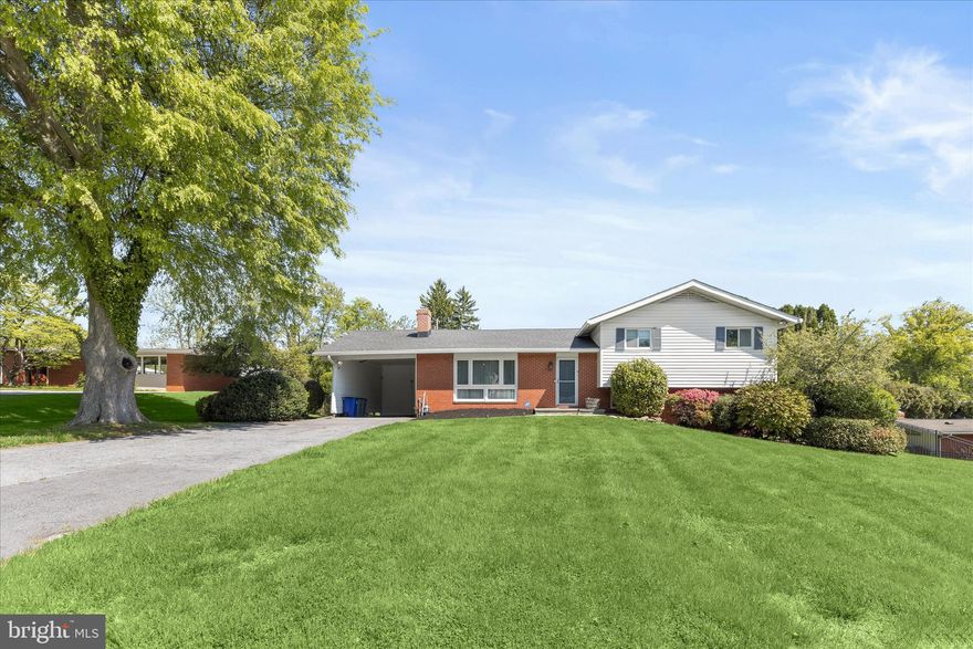 Tucked away on a quiet street in sought-after Stevenson, this five bedroom, two full and one half bathroom home sits on a pristine half-acre lot and offers a seamless blend of comfort, updates, and inviting outdoor living, along with flexible interior spaces that easily adapt to everyday living, entertaining, or working from home. Inside, a redesigned open floor plan is enhanced by a neutral color palette, vaulted ceilings, and rich hardwood floors that flow through the spacious living and dining rooms. Large sliding glass doors in the dining area open to a deck with a retractable awning, creating an easy transition to the peaceful backyard setting. The renovated kitchen is both stylish and functional, featuring quartz countertops, a subway tile backsplash, 42-inch soft-close cabinetry with under-cabinet lighting and pull-out shelving, a farmhouse sink, and a breakfast peninsula for casual dining. Stainless steel appliances include a refrigerator/freezer, beverage and wine fridge, built-in microwave, dishwasher, and a gas range with double ovens and a range hood. The primary suite serves as a private retreat with a thoughtfully designed bathroom addition, complete with a frameless glass walk-in shower with dual shower heads, heated tile floors, a dual sink vanity, and a towel warmer.  A spacious walk-in closet and custom wardrobes complete the suite. Two additional bedrooms and a full bathroom are also located on the upper level. The lower level offers a comfortable family room with custom built-ins, a gas fireplace, and access to a covered patio, along with a fourth bedroom, half bathroom, and laundry room. An additional level provides a flexible recreation space, fifth bedroom, and extensive storage, including a utility room and a rare fallout shelter. Step outside to your own private outdoor oasis, with space for dining on the deck, relaxing on the covered patio, playing in the expansive yard, or enjoying the heated saltwater pool with an energy-efficient automated heating system. All of this in a super convenient Stevenson location, just minutes from 695 and 83, and close to shopping, dining, and everything the area has to offer.