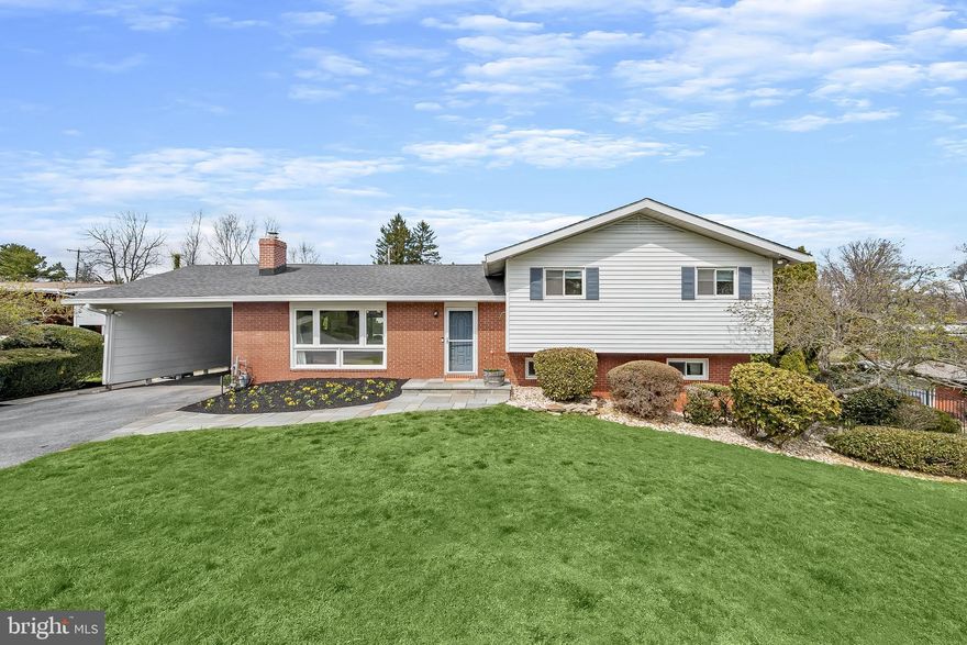 Tucked away on a quiet street in sought-after Stevenson, this five bedroom, two full and one half bathroom home sits on a pristine half-acre lot and offers a seamless blend of comfort, updates, and inviting outdoor living, along with flexible interior spaces that easily adapt to everyday living, entertaining, or working from home. Inside, a redesigned open floor plan is enhanced by a neutral color palette, vaulted ceilings, and rich hardwood floors that flow through the spacious living and dining rooms. Large sliding glass doors in the dining area open to a deck with a retractable awning, creating an easy transition to the peaceful backyard setting. The renovated kitchen is both stylish and functional, featuring quartz countertops, a subway tile backsplash, 42-inch soft-close cabinetry with under-cabinet lighting and pull-out shelving, a farmhouse sink, and a breakfast peninsula for casual dining. Stainless steel appliances include a refrigerator/freezer, beverage and wine fridge, built-in microwave, dishwasher, and a gas range with double ovens and a range hood. The primary suite serves as a private retreat with a thoughtfully designed bathroom addition, complete with a frameless glass walk-in shower with dual shower heads, heated tile floors, a dual sink vanity, and a towel warmer.  A spacious walk-in closet and custom wardrobes complete the suite. Two additional bedrooms and a full bathroom are also located on the upper level. The lower level offers a comfortable family room with custom built-ins, a gas fireplace, and access to a covered patio, along with a fourth bedroom, half bathroom, and laundry room. An additional level provides a flexible recreation space, fifth bedroom, and extensive storage, including a utility room and a rare fallout shelter. Step outside to your own private outdoor oasis, with space for dining on the deck, relaxing on the covered patio, playing in the expansive yard, or enjoying the heated saltwater pool with an energy-efficient automated heating system. All of this in a super convenient Stevenson location, just minutes from 695 and 83, and close to shopping, dining, and everything the area has to offer.