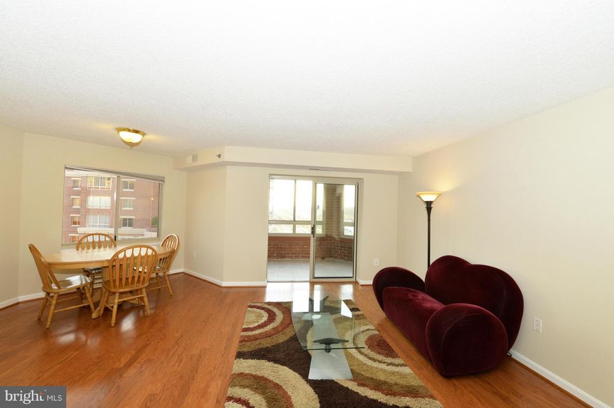 1 BR, 1 BA has DR area, kit table area, W/D & encl balcony (not incl in 728 sqft), which creates a bright, light, warm  home. NEW Wood floors,  BR carpet, balcony tile & paint through out. Enjoy the view from the 19th flr. Rent incl garage & storage. Enjoy Carlyle's amenities: pool, 2 gyms, tennis, putting green, 24-hr security, etc. Just blocks to metro, PTO,shops,movies,restaurants & Whole Foods