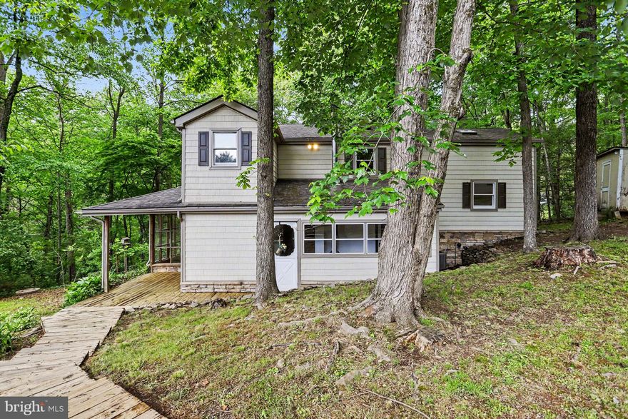 Welcome to 156 Oak Heights Trail — a beautifully maintained home tucked away in a peaceful setting in Delta, PA! This spacious property offers the perfect blend of privacy, comfort, and modern updates, all surrounded by scenic wooded views. Step inside to find a bright and inviting interior featuring generously sized living spaces, modern finishes, and abundant natural light throughout. The updated kitchen boasts ample cabinetry, modern appliances, and plenty of workspace, flowing seamlessly into the dining and living areas — perfect for both everyday living and entertaining guests. The second-floor loft creates the perfect bonus space for a home office, reading area, or flex room. The primary suite offers a relaxing retreat with a private bath, while the additional bedrooms provide flexibility for family or guests. Outside, enjoy the tranquil backyard setting from the expansive deck and outdoor entertaining areas overlooking the surrounding trees and nature. Car enthusiasts, hobbyists, or those in need of extra storage will appreciate the oversized detached heated garage along with an additional detached pole building offering endless possibilities. Conveniently located with easy access to Maryland, Lancaster, and York, this property offers the peaceful feel of country living while still being within reach of shopping, dining, and commuter routes. Don’t miss your opportunity to own this move-in ready home in a beautiful setting!