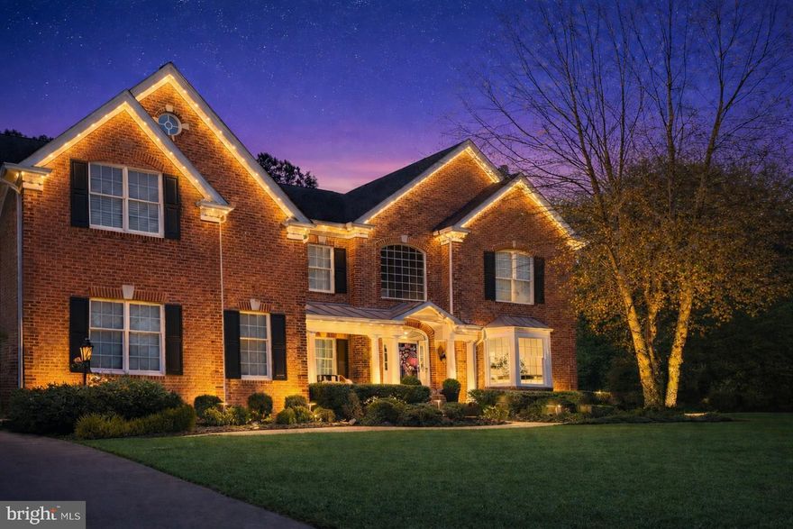 COMING SOON — Professional Photos Available April 17.

There are many nice homes in Dominion Valley, but only a few Estate homes that deliver the full Country Club lifestyle. This stunning home sits steps from the Club, driving range, fitness center, resort-style pool, pickleball, tennis, Palmer's Grill, tot lot, and more — yet backs to the 8th hole of the legendary Arnold Palmer Golf Course inside this prestigious gated community. 

From the moment you arrive, you know this home is something special — landscape lighting illuminates the entire exterior. Gleaming hardwood floors flow throughout the entire main level. The formal living room wraps you in warmth with a brick gas fireplace and a bay window that flows seamlessly into the dining room, where a triple window bathes the room's extensive molding in natural light. The private office provides the perfect work-from-home sanctuary.

The heart of this home is a showstopper: a FULLY REDESIGNED GOURMET KITCHEN — just one year new — featuring a 6-burner gas range and oven, an electric wall oven, a microwave/convection oven, and a coffee bar, all wrapped in upscale, stylish finishes. The kitchen opens seamlessly into the soaring 2-story family room, anchored by a dramatic floor-to-ceiling stone fireplace with gas inserts and a wall of windows that frames the golf course like a living painting. In-ceiling speakers set the perfect ambiance for effortless entertaining.

Step through the glass doors into the custom 23-by-14-foot sunroom addition — surrounded on three sides by glass and overlooking the fairway — this is the space you will never want to leave. The full-length main-level deck extends your living even further, perfect for entertaining at any hour, in any season.

Upstairs, the owner's suite is unlike any other. A glass door leads to a private upper deck (over 300 sq feet) — your personal retreat for morning coffee or an evening glass of wine. Inside, a custom coffee bar with sink, microwave, and wine fridge sets the tone. The spa-worthy owner's bath delivers heated tile floors, dual vanities, a seamless glass shower with dual heads, and a jetted soaking tub.  Each upper-level bedroom has been updated and curated with intention. One enjoys the luxury of a private en-suite bath with Luxury Series Cambria countertops. The two additional bedrooms share an elegantly designed Jack-and-Jill bath — a true retreat of its own, featuring exotic granite, a shiplapped accent wall, and designer finishes that elevate every detail.

The lower level is a world unto itself. Gather in the theater room with a 100-inch projector screen and built-in banquet seating — perfect for cards, pizza nights, and movie marathons. A full wet bar with beverage fridge, a spacious recreation area, a private 5th guest suite with dressing area, walk-in closet, full bath, and laundry make this level as functional as it is fun. A bonus exercise/office room rounds out this exceptional space.

  Every detail has been considered — from the three-car side-turned garage and expansive driveway to the in-ground sprinkler system and holiday lighting package that keeps the grounds picture-perfect. A new roof, updated HVAC unit, and all-new kitchen appliances since 2023 give buyers the rare confidence of moving into a home where the work is already done. Simply arrive, settle in, and embrace the life you have been waiting for!