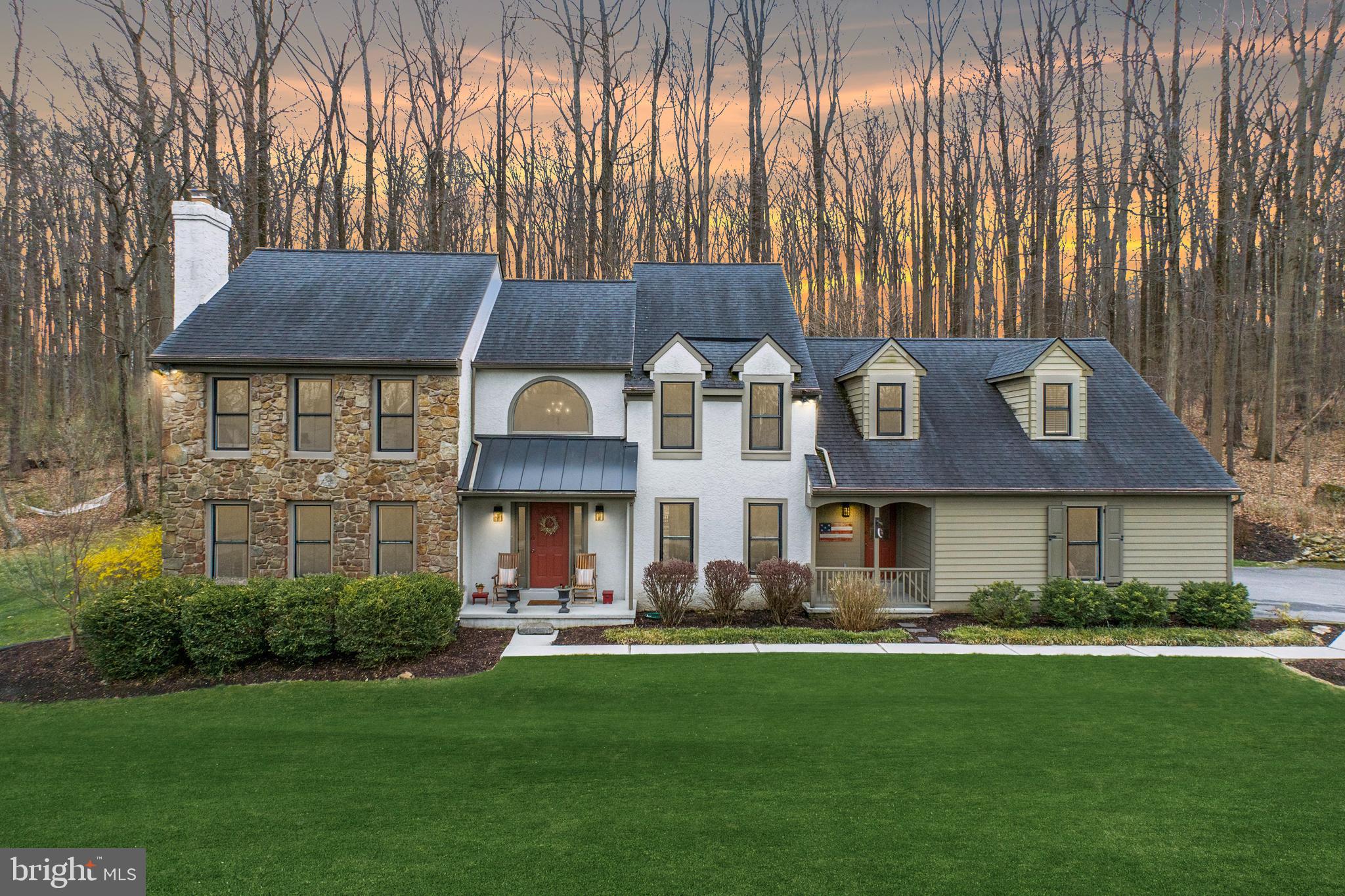 You’ll fall in love with this Glenmoore Semi Custom 4 Bedroom home on 5.2 acres, nested in a private community of 17 properties. As you enter, you’ll be welcomed by hardwood floors and a turn style wood staircase flanked by the living room w/wood burning fireplace and formal dining room. The impressive family room boasts vaulted ceiling w/ skylights, wood flooring, and a floor to ceiling real stone fireplace with wood stove insert. The large windows bathe this space in natural light while offering tranquil views of the surrounding landscape. The modern kitchen features a breakfast area, soap stone counter tops, farmhouse sink, wall mounted double oven, cook top and decorative iron pipe shelving over the coffee bar. The spacious laundry room is conveniently located on the main floor along with the recently updated powder room and a first-floor office. Upstairs, the primary suite provides for a relaxing retreat with walk-in-closets and en-suite bathroom w/soaking tub and glass enclosed shower. The three generously sized additional bedrooms share the double sink center hall bathroom. The third bedroom is huge and could be used as an upper great room. Outside, enjoy the peaceful setting of your private partially wooded lot, with room for a future pool or vegetable garden. The expansive backyard offers endless possibilities for entertaining or relaxing. Additional highlights include paver brick patio slate patio w/fire pit, genuine Pennsylvania field stone exterior, natural stone garden walls, replacement windows 2022 and an American Preferred Home Warranty for the buyers! The community HOA fee is $350 a year, and amenities include tennis and pickle ball courts, walking trails, and fishing pond. This serene setting offers tremendous privacy yet has the convenience of Shopping and Restaurants of Exton, and close to major routes- like PA turnpike & route 100. This Glenmoore gem is a rare find!