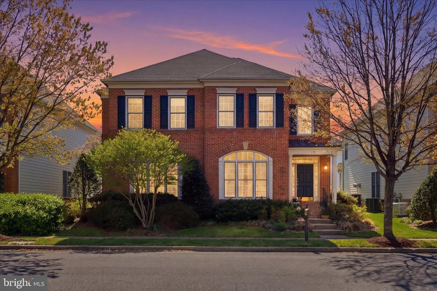 Welcome to The Somerfield in “English Style,” where timeless architecture meets modern comfort on one of the most desirable streets in Kingsport. From the moment you arrive, you’ll notice the striking brick façade with arched transom windows and formal pediments, all set along a tree-lined street with sidewalks and exceptional curb appeal, with the community pool located directly across the wide street adding to the charm. Offering nearly 5,000 square feet of finished living space, this open and airy 5-bedroom, 4.5-bath home has been meticulously maintained and thoughtfully updated, including a newer roof and full HVAC system. Additional upgrades include an in-ground sprinkler system, alarm system, custom exterior lighting on timers, and extensive recessed lighting throughout. The main level features sleek hardwood flooring throughout, creating a seamless flow ideal for everyday living and entertaining. The gourmet kitchen is equipped with stainless steel appliances, including a 5-burner Jenn-Air cooktop, double wall ovens, side-by-side refrigerator, dishwasher, and microwave, and opens to a soaring family room with fireplace and expansive windows overlooking the private fenced backyard. Step outside to a beautiful brick patio surrounded by professionally designed gardens and flowering landscape, creating the perfect setting for hosting dinners, barbecues, morning coffee, or happy hour. A private main-level library/office provides an ideal work-from-home space. The upper level features four spacious bedrooms and three full baths, including a luxurious primary suite with hardwood flooring and a spa-like bath designed for relaxation, while formal living and dining rooms are enhanced with architectural pillars, transom windows, and well-maintained hardwood flooring. The fully finished lower level offers a large recreation area, a fifth bedroom or office with egress, a full bath, and additional insulated space for a gym, craft room, or storage. Kingsport offers a wealth of amenities including a community pool, playgrounds, walking paths, water access, and park-like green spaces, all conveniently located near shopping, dining, major commuter routes, the airport, and historic downtown Annapolis. Home is being sold as-is, where-is, with no guarantees or warranties. A one-year home warranty is included.