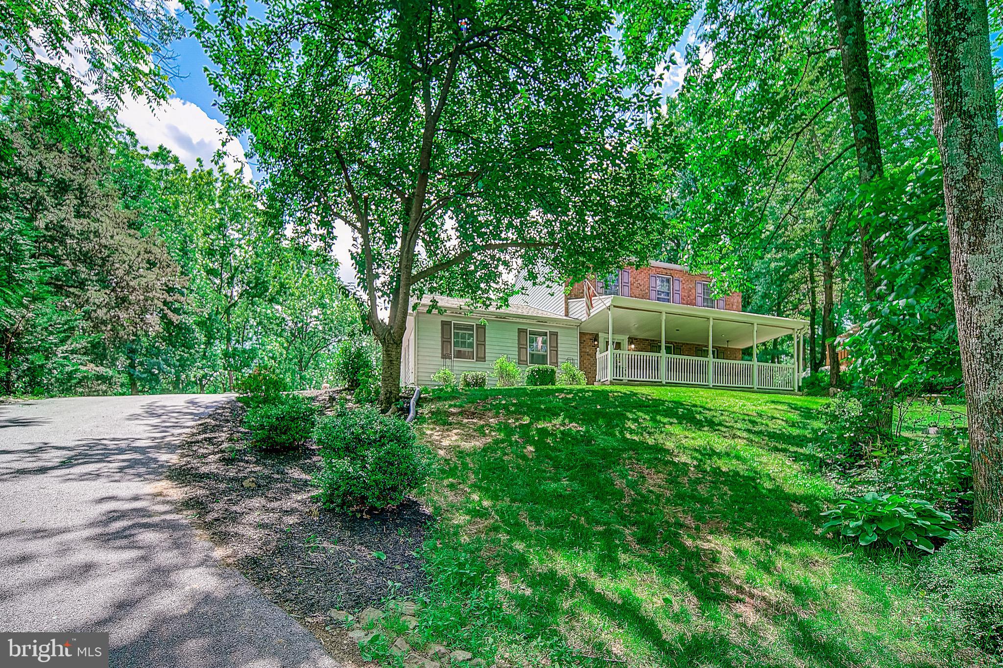 Don't miss this lovingly updated colonial complete with a charming front porch, renovated kitchen, and sunny enclosed 3 season room that overlooks the sprawling rear yard with concrete patio and fenced-in private swimming pool! As you enter, gleaming hardwood floors greet you throughout the living room and formal dining room. The kitchen features a custom remodel boasting designer cabinets, stainless steel appliances, breakfast bar, and complimentary tile flooring and backsplash. A convenient first floor bedroom adjacent to updated powder room rounds out the first level of this home. The upper floor features 3 well appointed bedrooms including the master suite which features an updated ensuite bath. There is plenty of extra storage and living space in the partially finished basement. Expanded driveway and detached 1 car garage make parking for guests a breeze. This is the one!