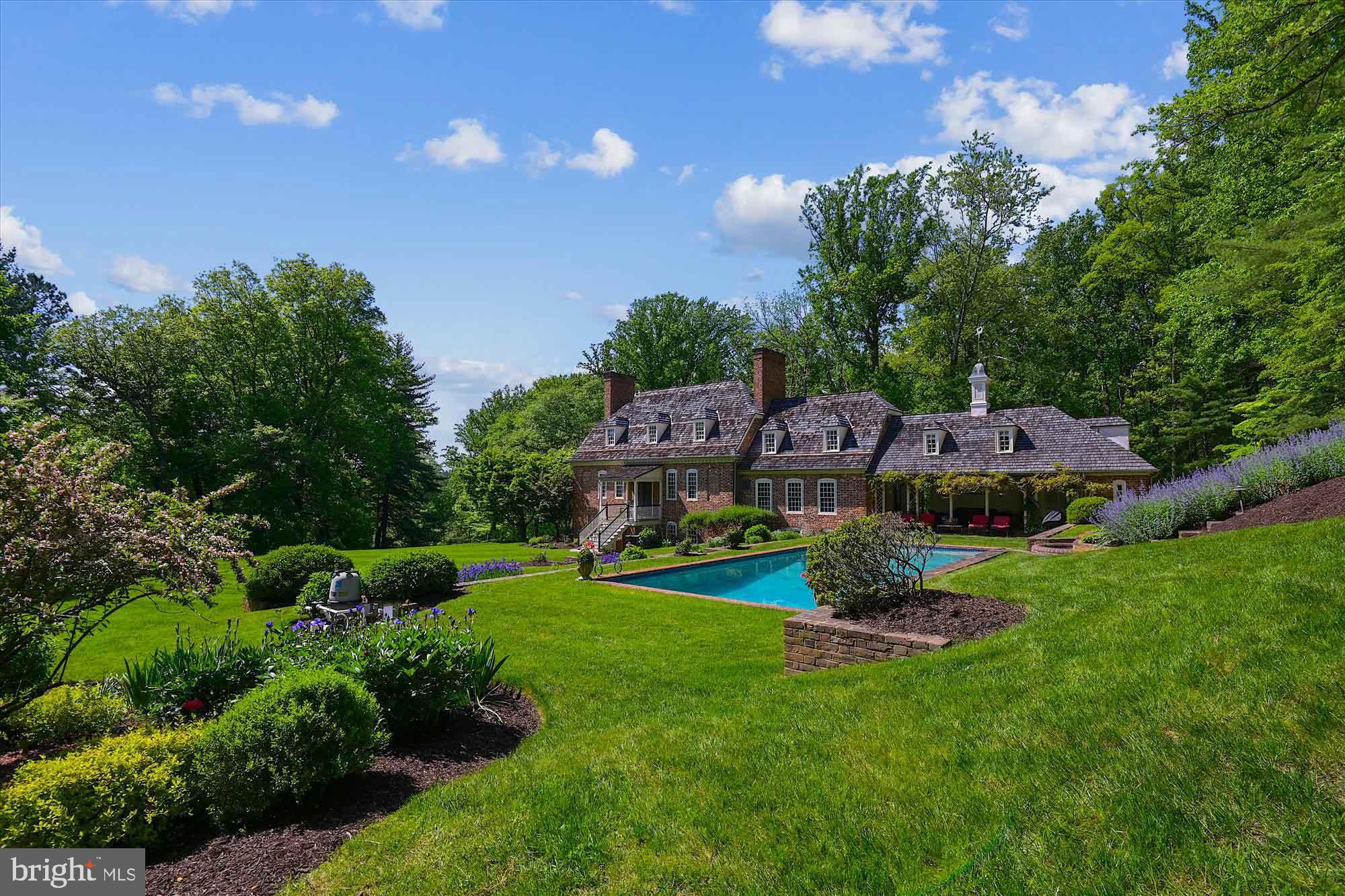 Live authentically. BEST OFFERS DUE BY FRIDAY, JULY 21 MIDNGHT. SELLER PREFERS NO ESCALATION CLAUSES. The Ross House was built beside the Potomac River in Bladensburg, Maryland in 1749 by Dr. David Ross, a surgeon in the Continental Army. During the War of 1812, it was used as a hospital for British and American soldiers. The home was carefully dismantled in 1957, but 22,000 bricks, windows, flooring, paneling , doors, and handmade nails were preserved for five years. In 1962, Leonard C. Crewe Jr. sought to build a colonial style home. He commissioned Bryden B. Hyde, a Baltimore-based architect and an officer for the Society for the Preservation of Maryland Antiquities, to design the home. Hyde suggested to Crewe to reconstruct a historic home instead. John Hurst Purnell Jr., an architect who specialized in the restoration of 18th and19th century homes, oversaw the project as a general contractor. The house was rebuilt with mortar made from oyster shells, a historically accurate additive. In addition to original elements from the Ross House, authentic mid-18th century materials from other buildings were used when needed. The successful reproduction of the original Ross House was completed in three years on the property known as Preservation Hill. The historical home has been meticulously preserved with concealed modern touches throughout. Masterful landscaping around the property includes indigenous plants and flowers known to early Maryland Colonials. Crewe enjoyed the process and was a dedicated preservationist. He set his sights on adding a guest house.
The Yeates House was built around 1738 in Turners Creek, Maryland. It was owned by Colonel Donaldson Yeates, commissary officer for the Eastern Shore in the Continental Army. Yeates purchased a seven-acre parcel with Tobias Rudolph, merchant of Cecil County, in 1770. Named Knocks Folly, it became a thriving village. In the 1960s, the president of the Kent Historical Society attempted to save the Yeates house at its original site. In the late 1960s, Leonard C. Crewe Jr. purchased the Yeates House for $5,000 to accompany the Ross House as a guest cottage on Preservation Hill. He again gathered Bryden B. Hyde as the architect and John Hurst Purnell Jr. as the builder to work on the reconstruction of the Yeates House. It took three years to complete the project. The preservation of history combined with modernity is eminent throughout the home.
A compelling package on a total 10.03 of acres consisting of two separately deeded parcels. The main house is sited gracefully on 6.75 acres. Old soul intact and modern lifestyle amenities in place. Glorious outdoor living sets the tone. A covered outdoor room with incredible brick flooring becomes the hub of all seasonal gatherings with your glistening pool and balanced native gardens in the distance. Tranquility abounds with the sounds of your tiered waterfall as a constant for all of your endeavors. Unwind in your sauna. Grab a bottle from the wine cellar, and cozy up by one of your ten working fireplaces, eleven total in the main house. Simply magnificent. Guest cottage is set gently on 3.28 acres and consists of an additional two to three bedrooms, kitchen, dining, and den. Comfortable and endearing. Once in a lifetime experience awaits you. A rare offering indeed. Comcast internet. Please book your appointment now. In the event the active date changes, you will be notified. Cultivate your existence. The art of uniting human and home. Please see listing MDBC2060962 for the main house and listing MDBC2061146 for the guest cottage. Tax assessment and related information in listing is for main house only.
