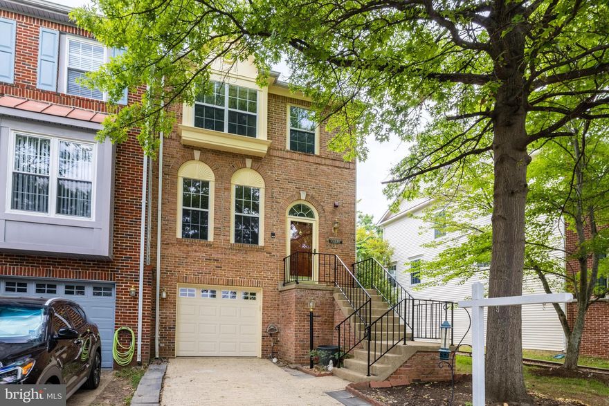 End unit garage townhome, 3 finished levels with bump outs , brand new carpet throughout upper and lower level, new flooring in kitchen bump out and fresh paint.  Freshly stained deck and fence.  Hardwood flooring on main level.  Large kitchen with stainless steel appliances, granite counter tops, island, gas fireplace and walkout to the deck.  Upper level has 3 spacious bedrooms.  Lower level has a rec room with fireplace, half bath, laundry room and a walkout to the privately fenced backyard.  Fantastic location close to metro, airport, commuter routes, restaurants, shopping and Reston Town Center.