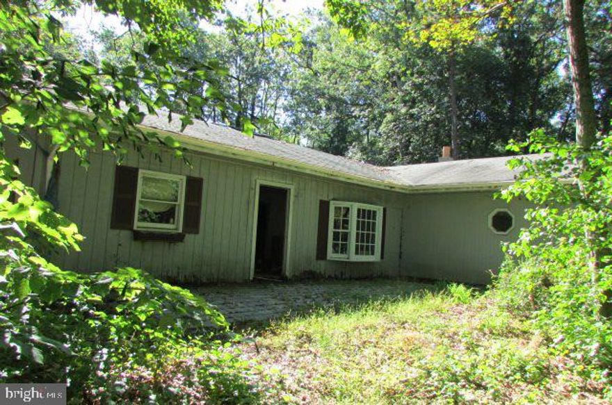 Ranch style house on a private lot just shy of 2 acres. Lots of potential. 3 bedrooms and 1 bath. Rear covered patio.