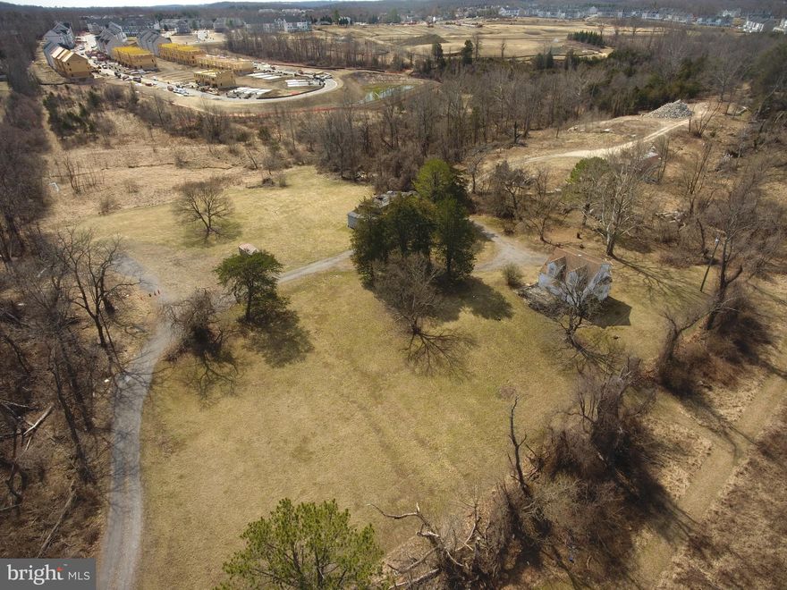 Incredible opportunity for investors, builders, or homebuyers! This 3-bedroom Cape Cod sits on 3.8 acres along a private drive with picturesque valley views.  The home needs TLC but offers great potential, featuring a solid stone foundation, original hardwood floors, and classic charm. Zoned DR1 which may allow for two additional homes (buyer to verify with county). Enjoy a unique setting that borders both scenic farmland and hiking trails while being just minutes from major business centers and transportation hubs. Adjacent property (owned separately) is available. Property subject to a deeded 20' Right of Way. Sold As-Is.