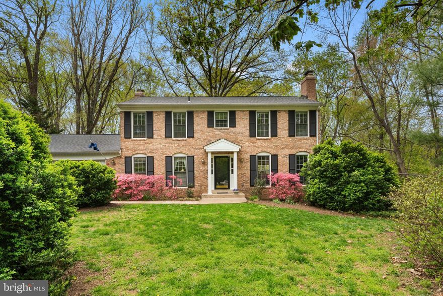 Welcome to 10505 Adel Rd – a handsome 4 bed, 3.5 bath Virginia Colonial-style home set on over an acre of land in highly sought after Oakton. As you arrive, tall mature trees and majestic box bushes immediately evoke a sense of privacy, creating a peaceful, tucked-away setting that makes this property truly special.
Step inside the welcoming foyer where the care and pride of ownership are immediately felt. The home opens into a spacious living room centered around an elegant fireplace, perfect for relaxing evenings or gathering with guests. Just beyond, the formal dining room is filled with natural light from a large bay window overlooking a tranquil, forested landscape – an inviting space for everyday meals and special occasions. The kitchen is open and airy with a functional layout designed for ease, along with a charming breakfast nook where you can enjoy your morning coffee. Or perhaps you’ll take your coffee outside on the deck, starting your day listening to the peaceful songs of morning birds. The kitchen connects to a large family room with ample space for casual living with an additional fireplace and built-in bookcases.
Upstairs, you will find four well-sized bedrooms and two full bathrooms, offering flexibility for guests, remote work, or additional living space. The primary suite provides a comfortable retreat with ensuite bath and spacious walk-in closet, making daily routines feel seamless. The walkout lower level adds even more versatility with a large open rec area that features a fireplace, separate den/office, and a full bathroom – ideal for entertainment, hobbies, or extended use.
Out back, the setting truly stands out. The forested area at the base of a downward slope not only provides striking sunset views from the deck, it also leads to a peaceful natural sanctuary with access to miles of hiking paths along a beautiful shallow, meandering stream. 
Low traffic in this cul-de-sac neighborhood of Avon Park provides for pleasant walks and fun activities, including a 4th of July bicycle parade, an annual fall picnic complete with visit from an Oakton fire engine, summer food trucks, a holiday lighting ceremony, and even a coordinated springtime garage sale.  Not an HOA, but much better: a warm community that even has a directory (participation optional) that makes finding household help a breeze, as well as a private Facebook page. Whether enjoying quiet mornings outdoors or exploring the surrounding landscape, this is a place to truly unwind. Schedule your tour and experience all that this unique Oakton property has to offer. 
Special Features: Quiet streets with low traffic; Access to hiking paths and a wonderful meandering, shallow creek to explore; A birder’s paradise: Current owner has recorded over 50 species of birds on the property; Central Vacuum System; Hardwood and ceramic tile floors on first and second floors; Finished walk-out lower level with fireplace, rec room, den, and full bath; Deck that overlooks a private, wooded one-acre lot; Approximately one mile to Route 123, shopping, restaurants, Oakton library, and the historic Greater Oakton Community Building.